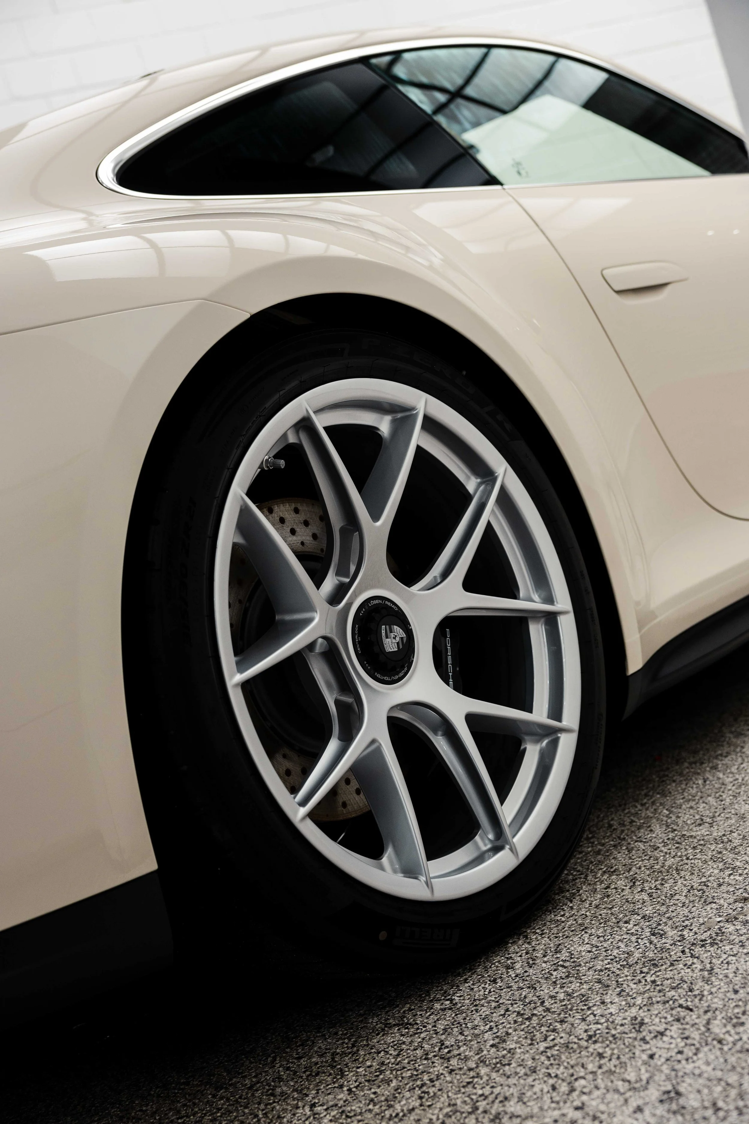 Cream Porsche 911 GT3 Touring wheel and rear guard with XPEL Paint Protection Film in Mona Vale