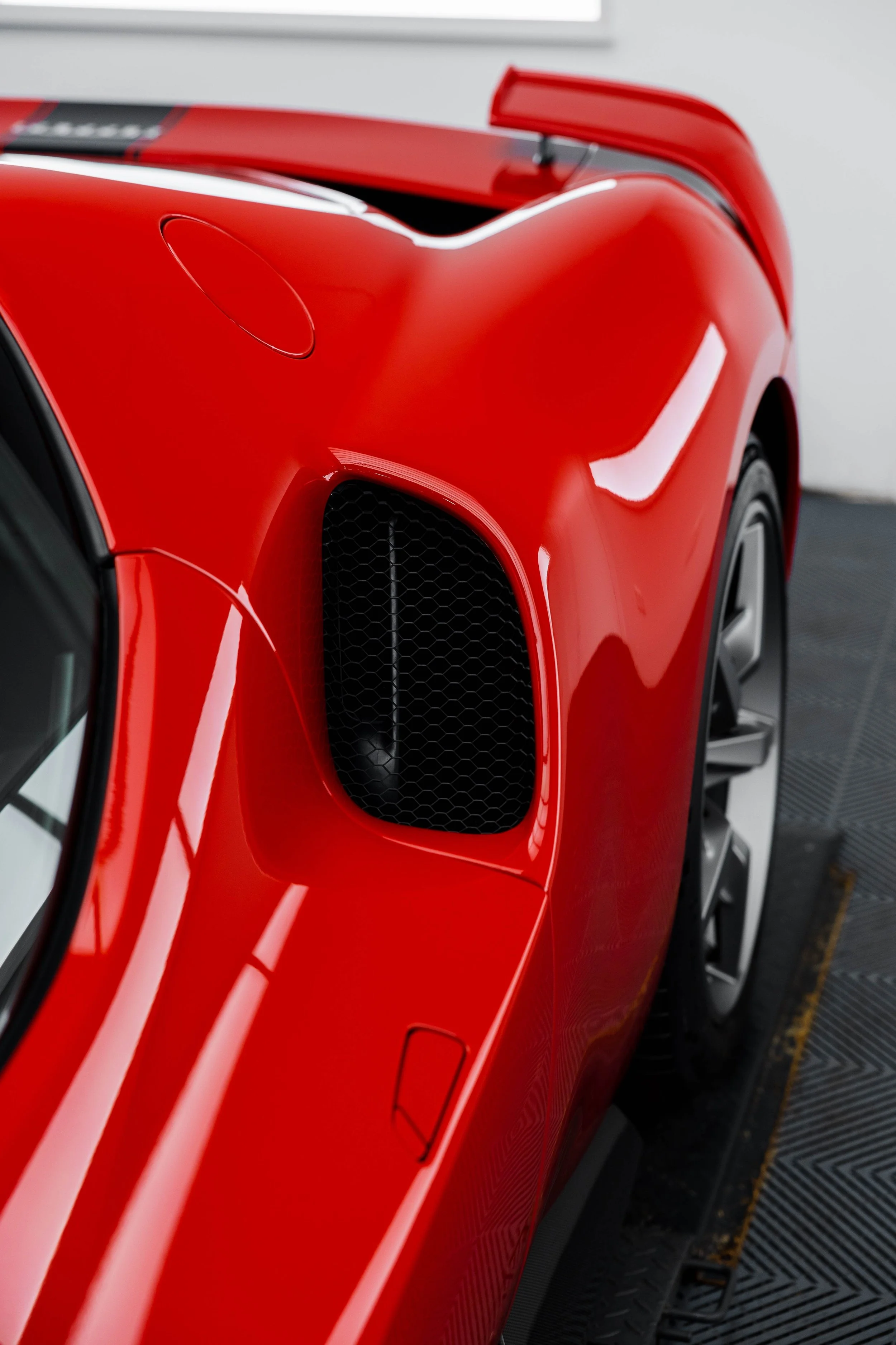 Red Ferrari 296 Speciale rear quarter air intake and rear wing with XPEL Paint Protection Film in Mona Vale