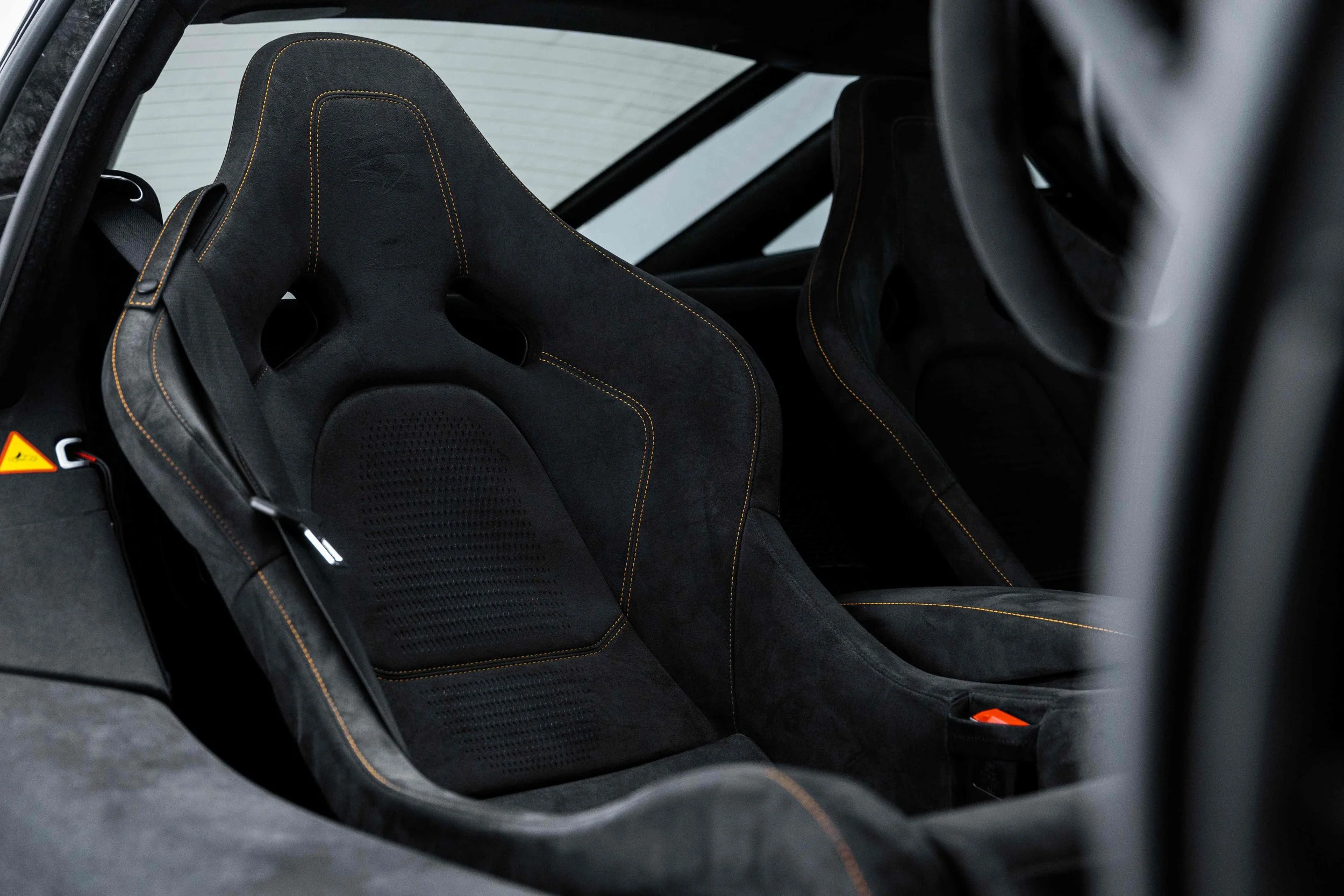Black McLaren 750S interior detailing racing seat with harness strap in Mona Vale