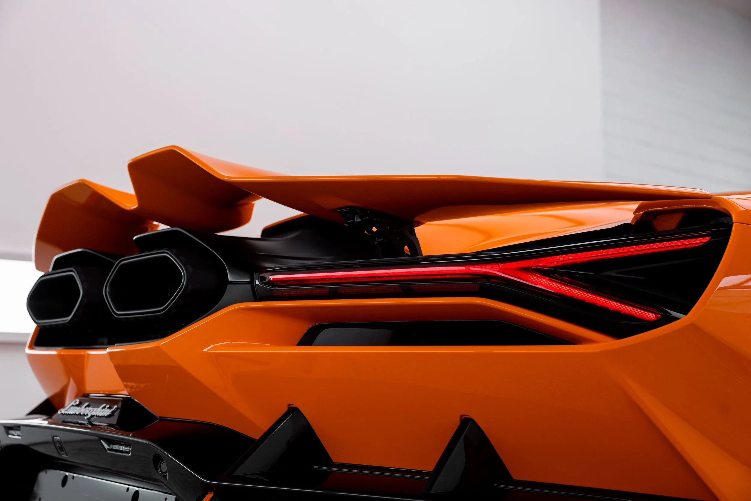 Orange Lamborghini Revuelto rear taillight and exhaust detail with full PPF by ADS in Mona Vale
