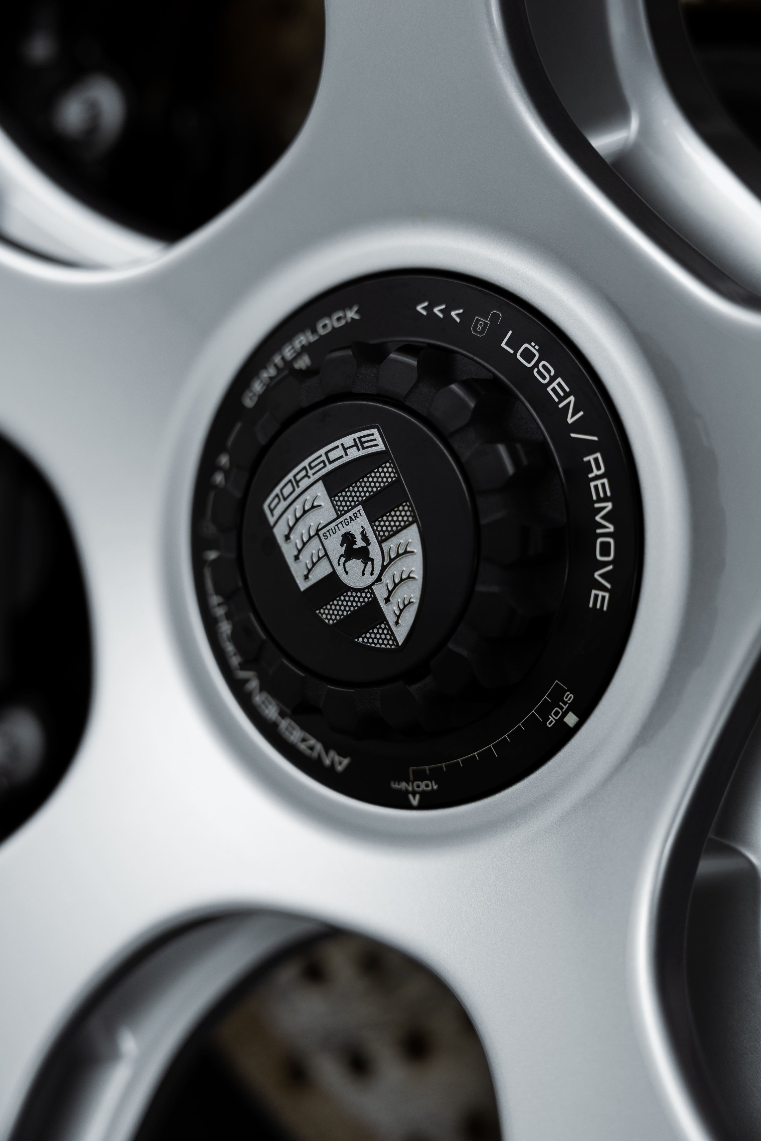 Porsche 911 GT3 Touring centre lock wheel hub with Porsche crest, showcasing precision engineering and performance-focused design protected by Australian Detailing Services Sydney