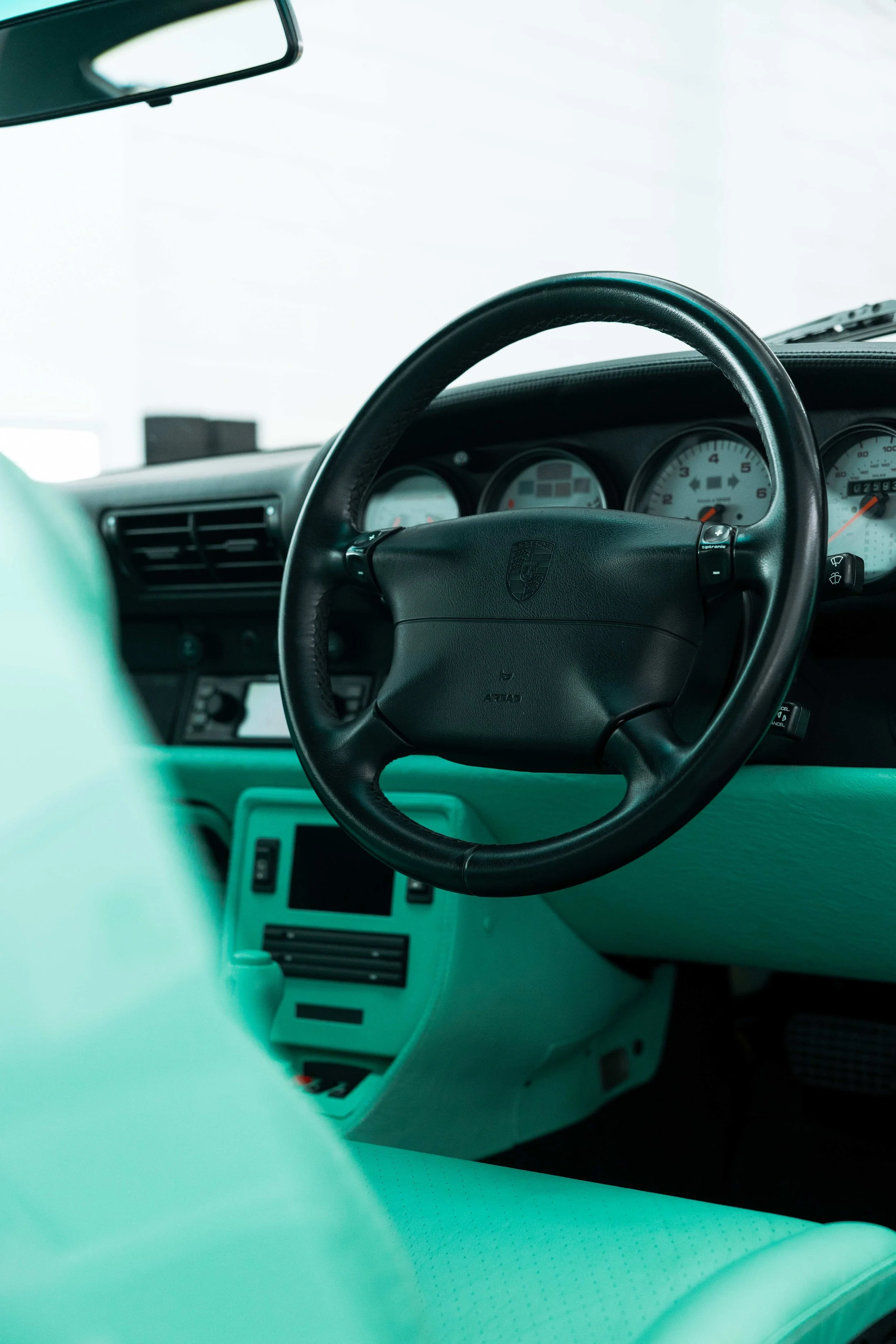 Porsche 993 steering wheel and mint green dashboard after interior detailing in Mona Vale