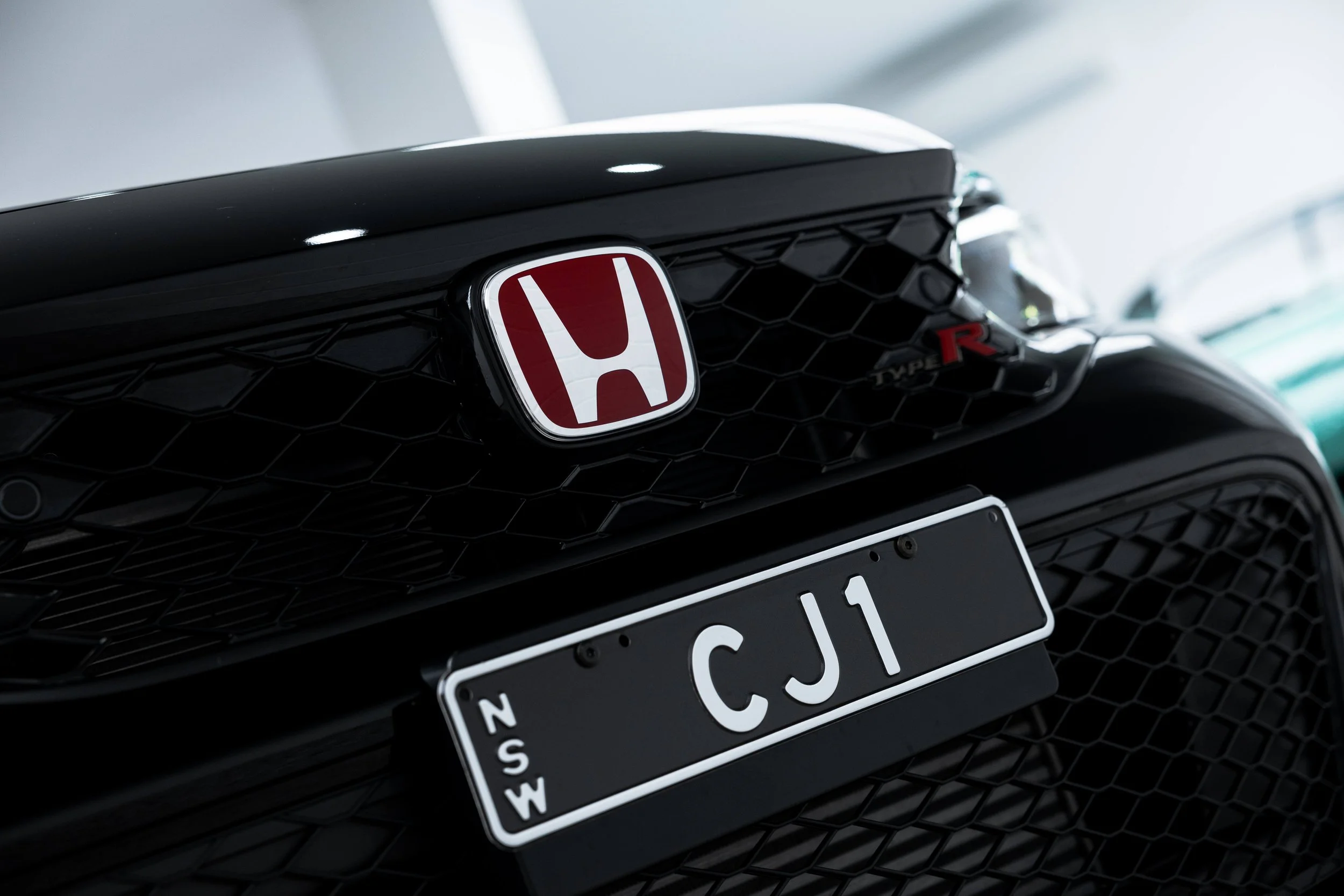Honda badge and number plate on Civic Type R grille with XPEL Paint Protection Film in Mona Vale