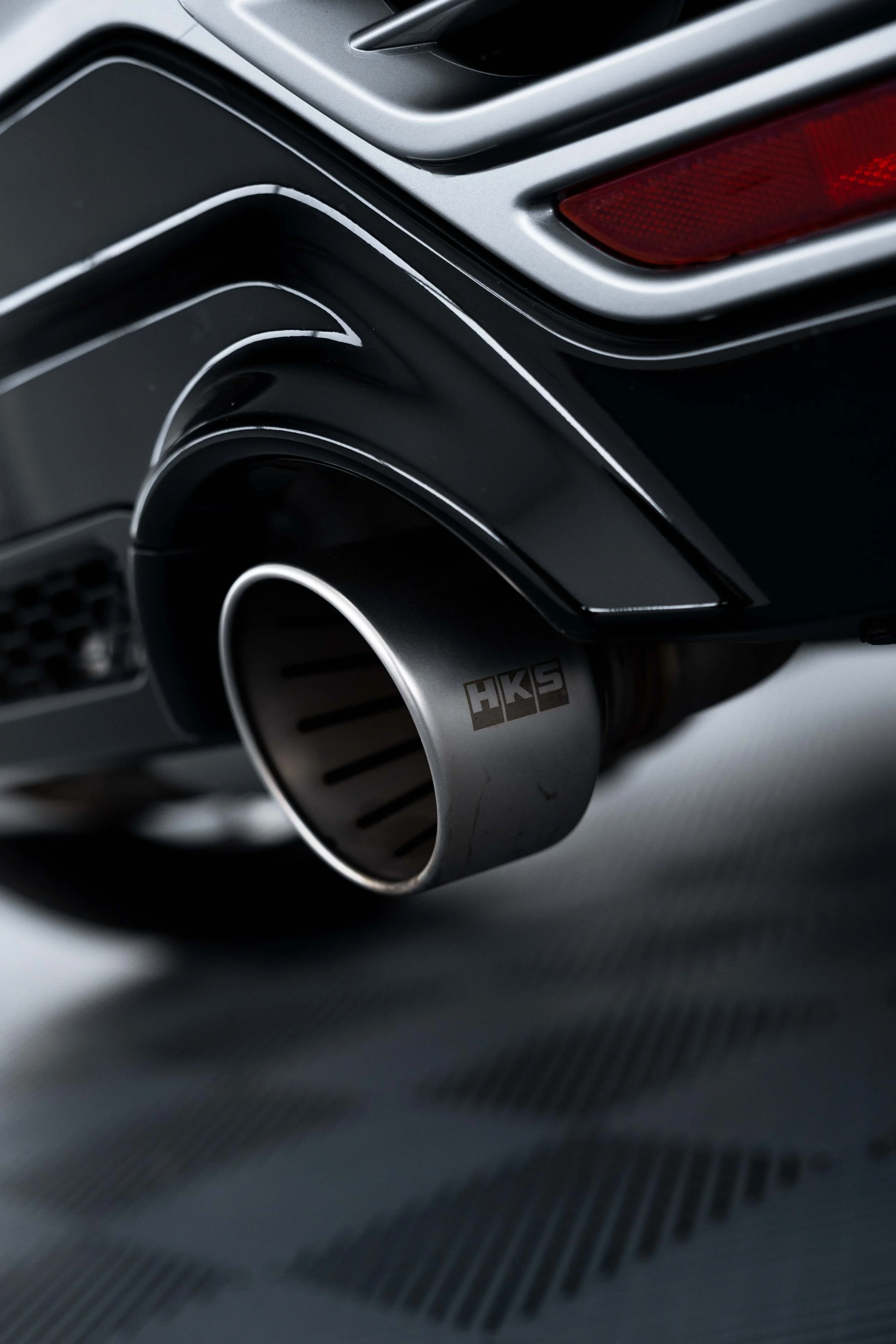 Matte grey Toyota GR Yaris HKS exhaust tip detail with XPEL Paint Protection Film in Mona Vale