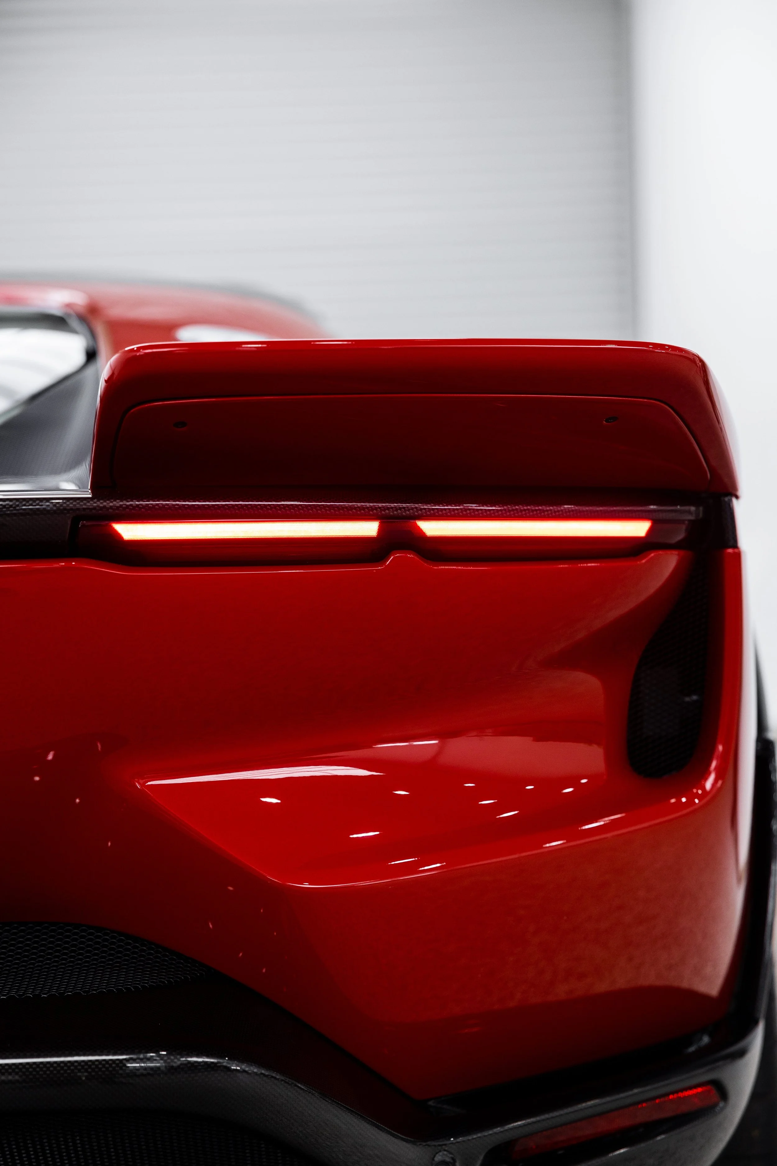 Red Ferrari 849 Testarossa tail light and rear bumper with XPEL Paint Protection Film in Mona Vale
