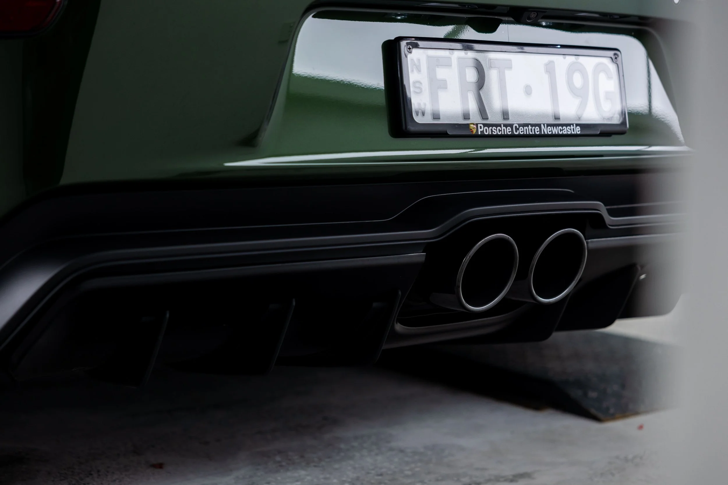 Green Porsche 911 GT3 Touring rear exhaust and diffuser detail with full PPF by ADS in Mona Vale