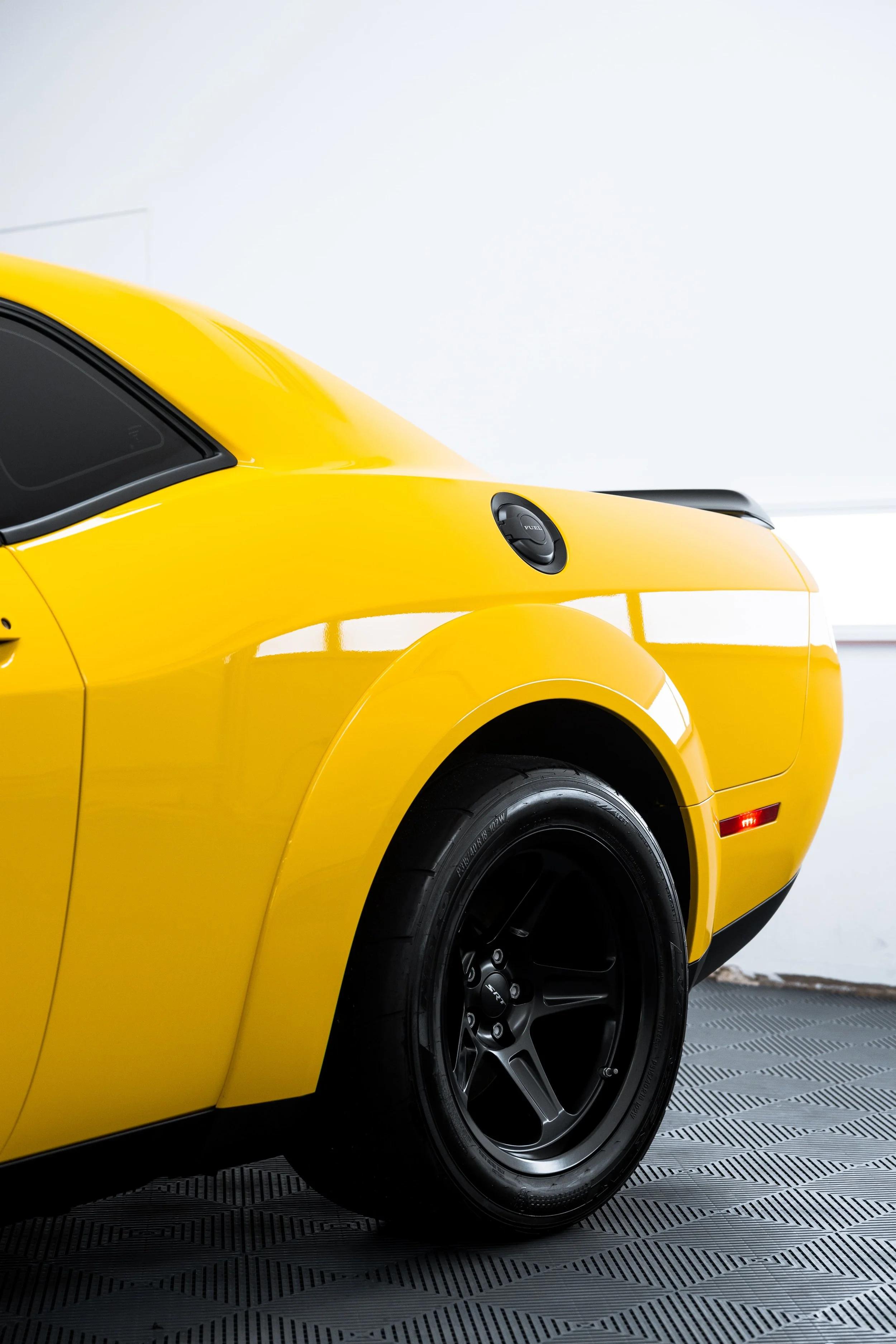 Rear quarter of yellow Dodge Challenger SRT Demon showing widebody fender and wheel with PPF by ADS in Mona Vale