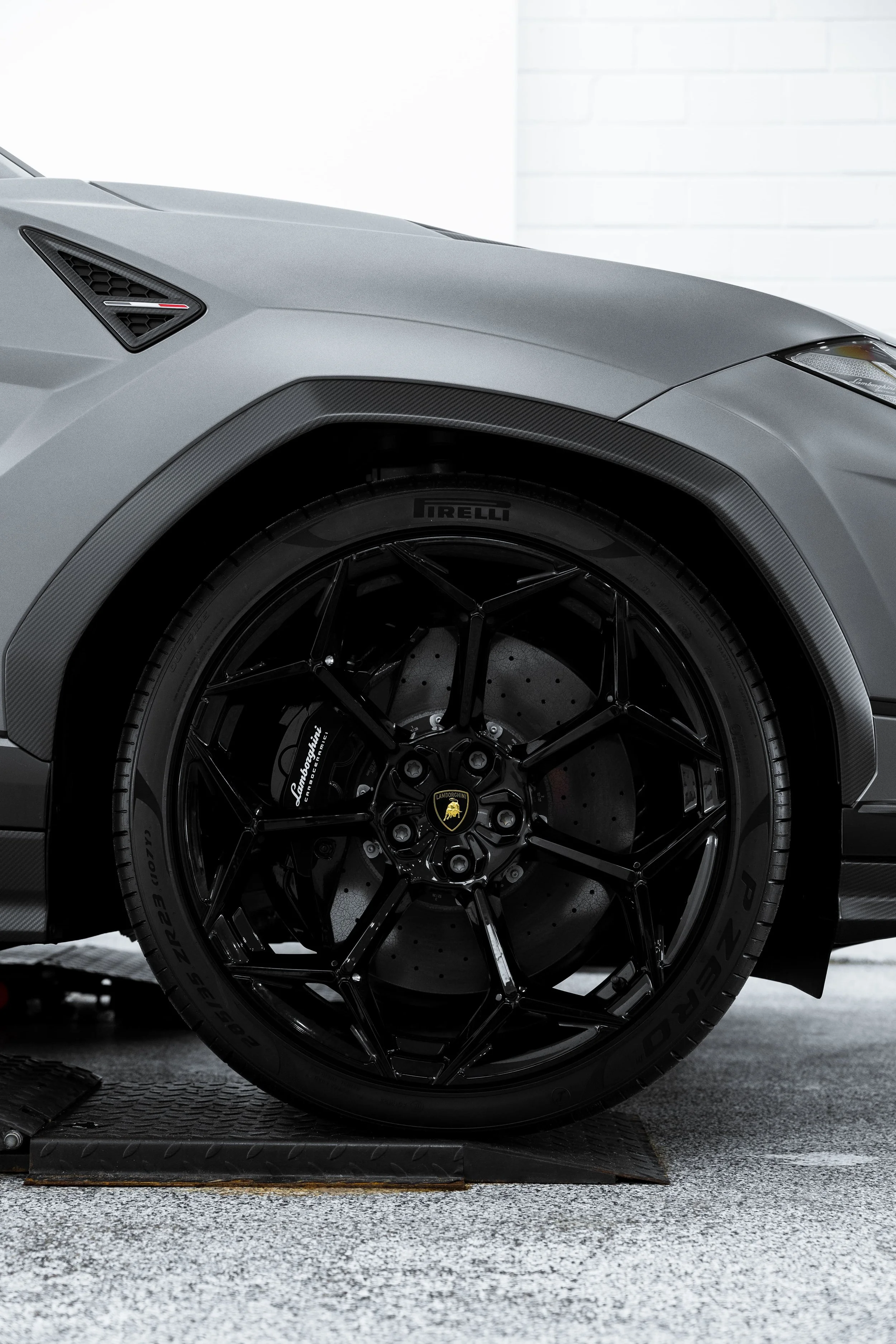 Lamborghini Urus wheel and carbon fibre arch detail with PPF protection by ADS in Sydney