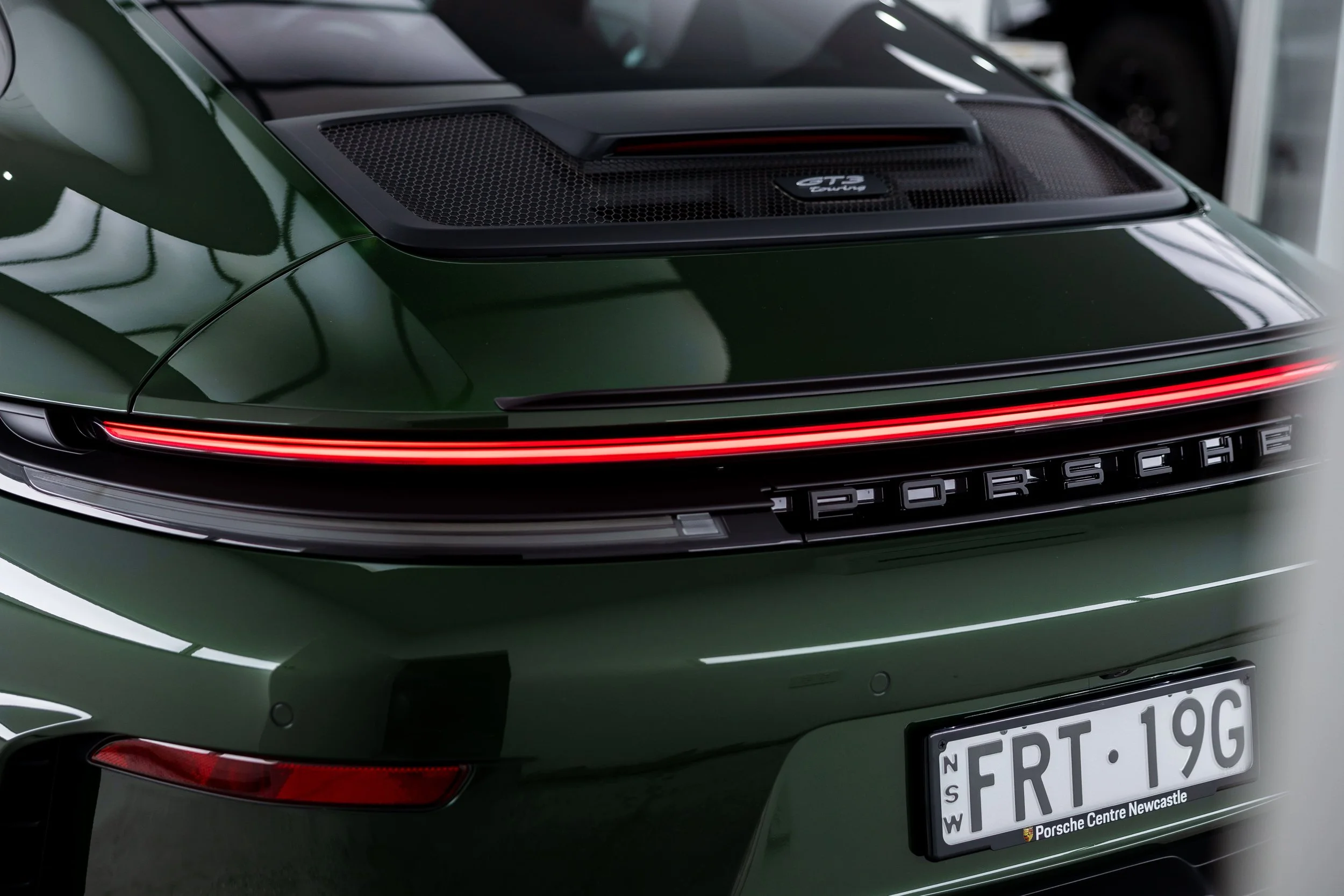 Green Porsche 911 GT3 Touring rear light bar and engine cover detail with full PPF by ADS in Mona Vale