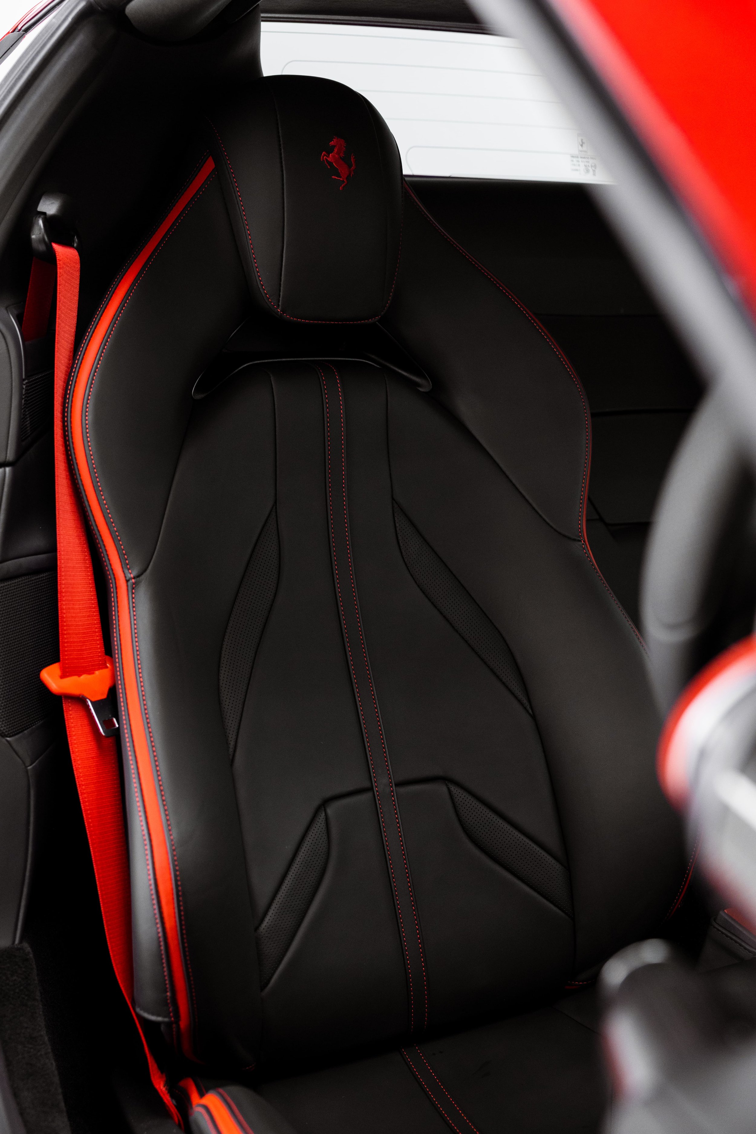Ferrari 812 GTS black leather sport seat with red stitching and red seatbelt detail by ADS in Sydney