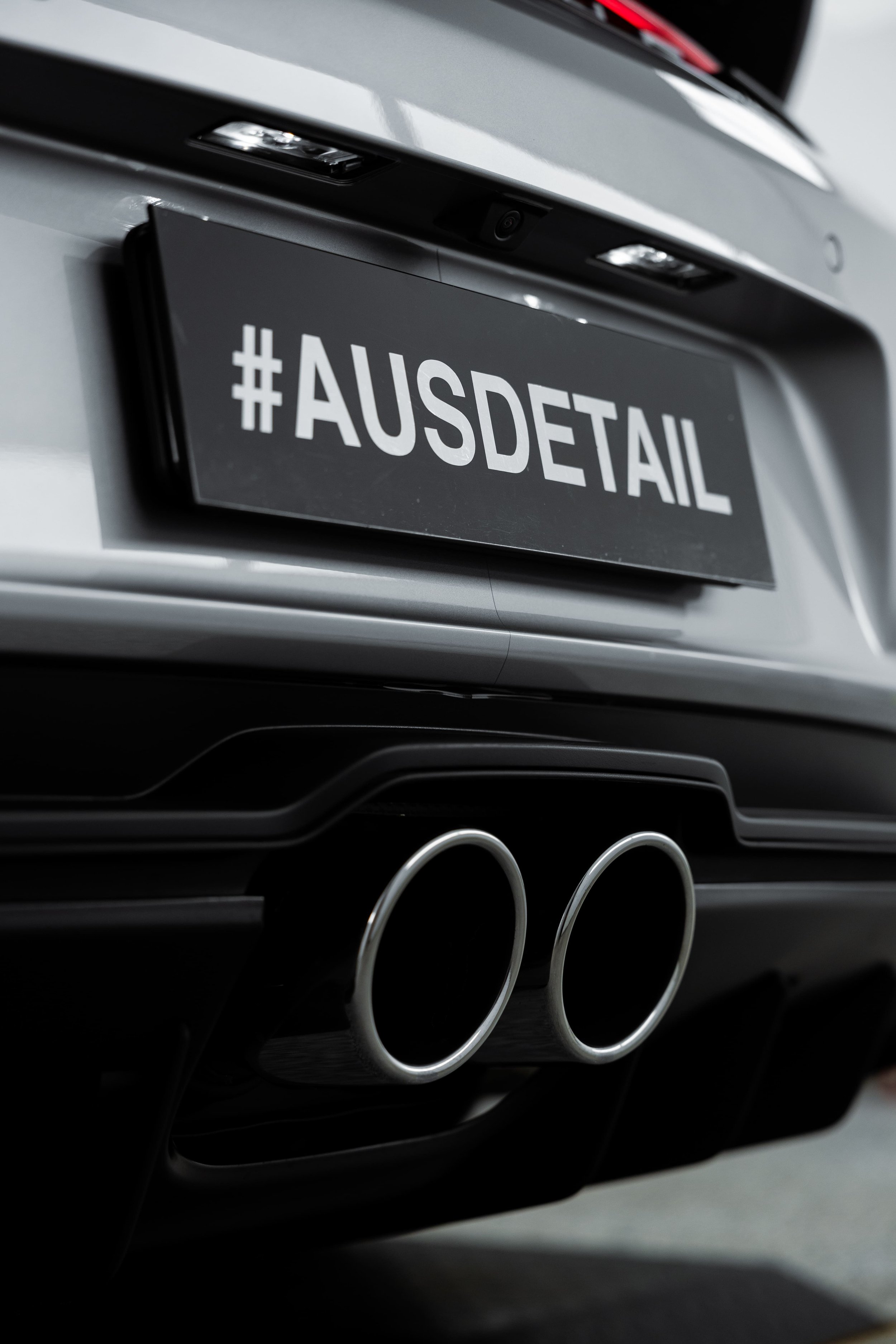 Porsche 911 GT3 Touring rear exhaust and diffuser detail with dual tips and gloss black finish, protected by PPF by Australian Detailing Services Sydney