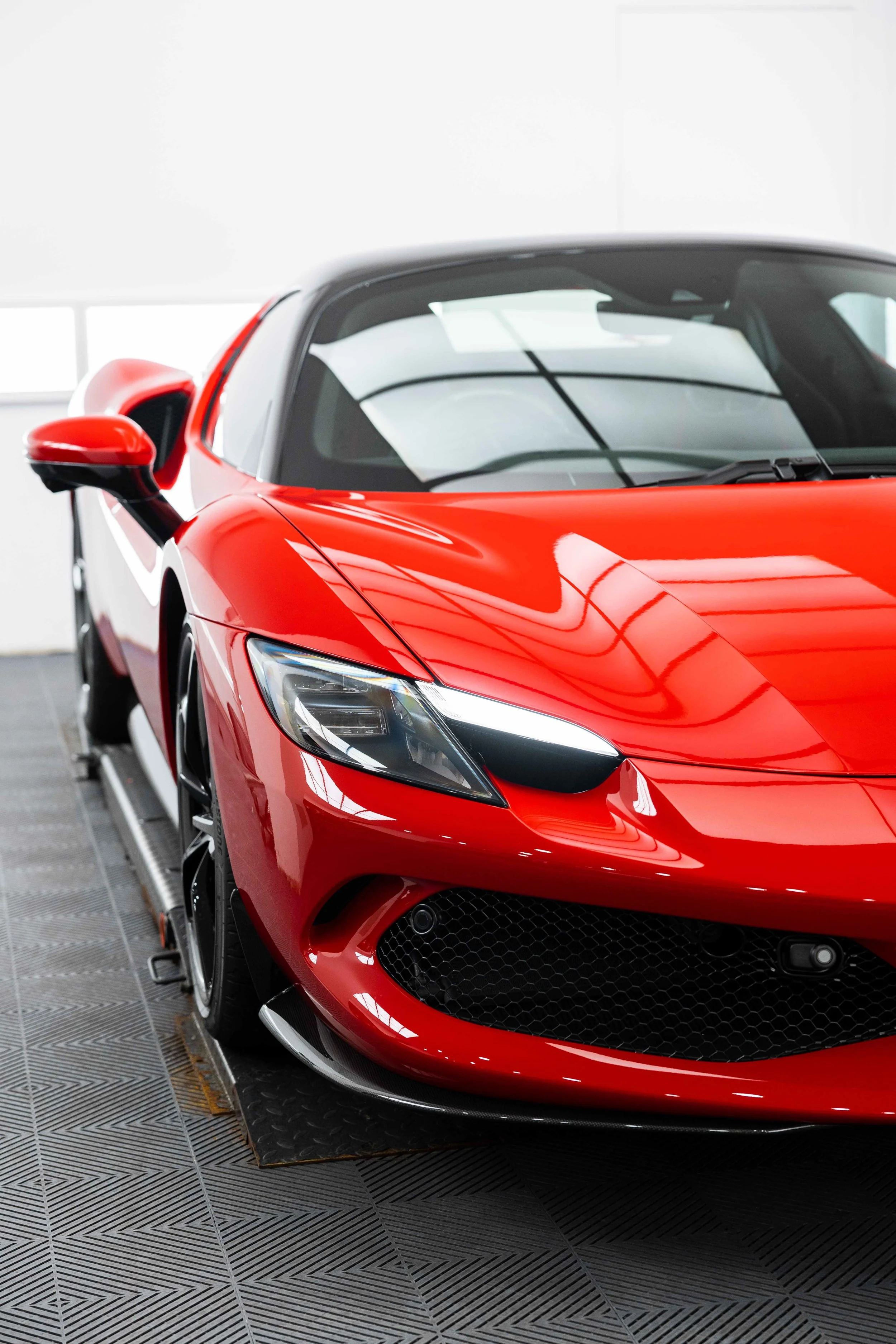 Red Ferrari 296 GTS front quarter and headlight with XPEL Paint Protection Film in Sydney