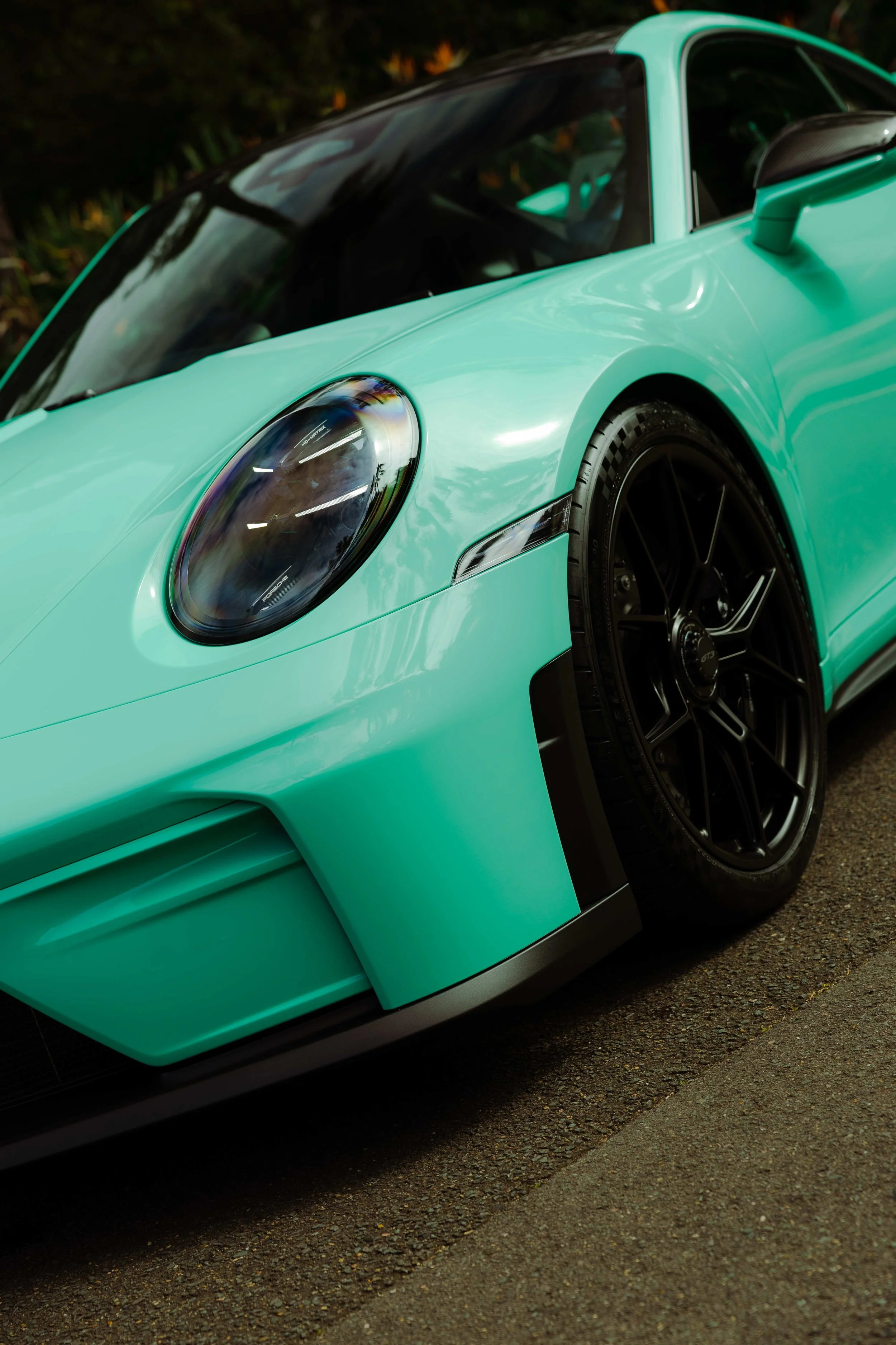 Mint green Porsche 911 GT3 front guard and headlight detail with XPEL Paint Protection Film in Mona Vale