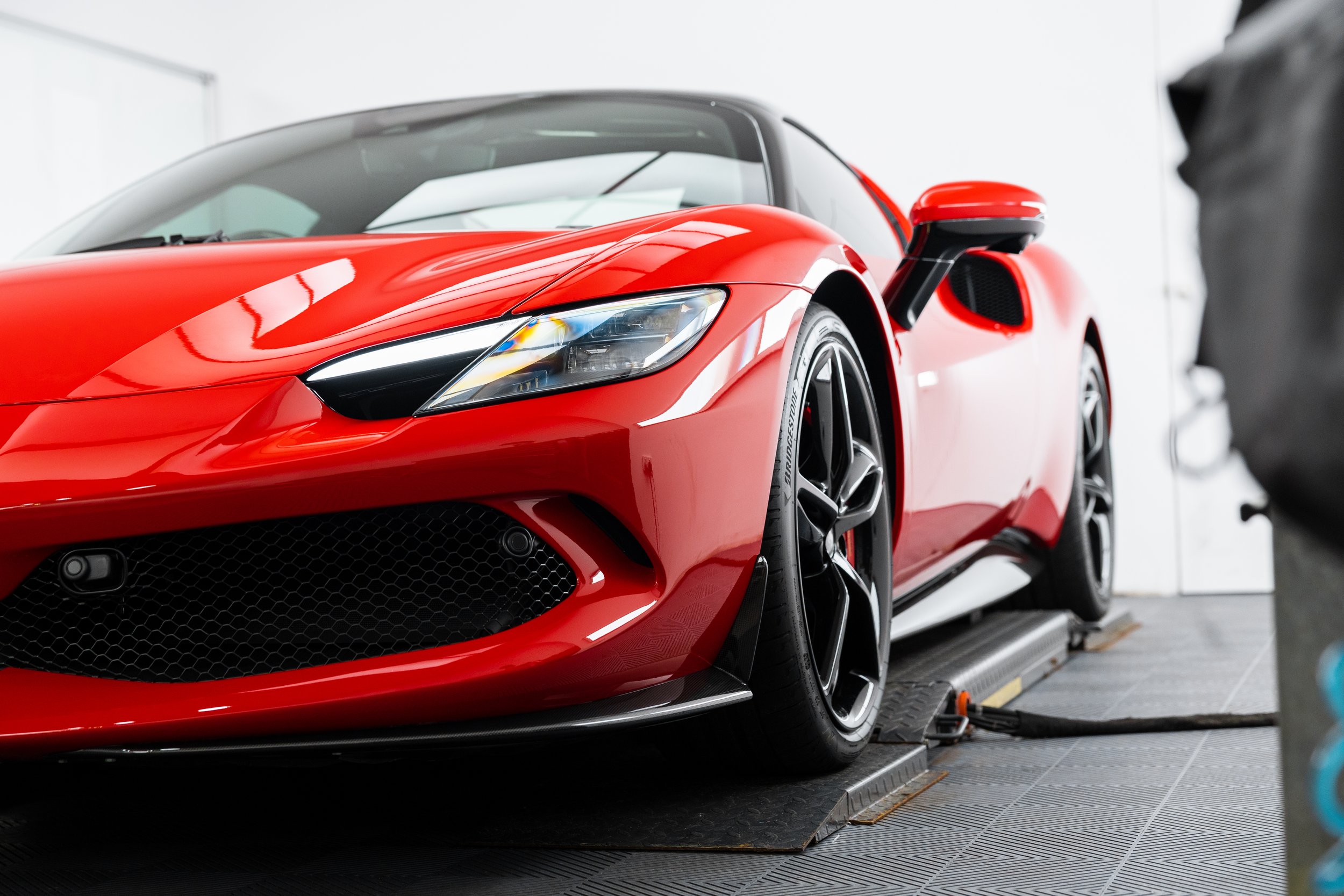 Red Ferrari 296 GTS front bumper and wheel XPEL paint protection film Sydney ADS
