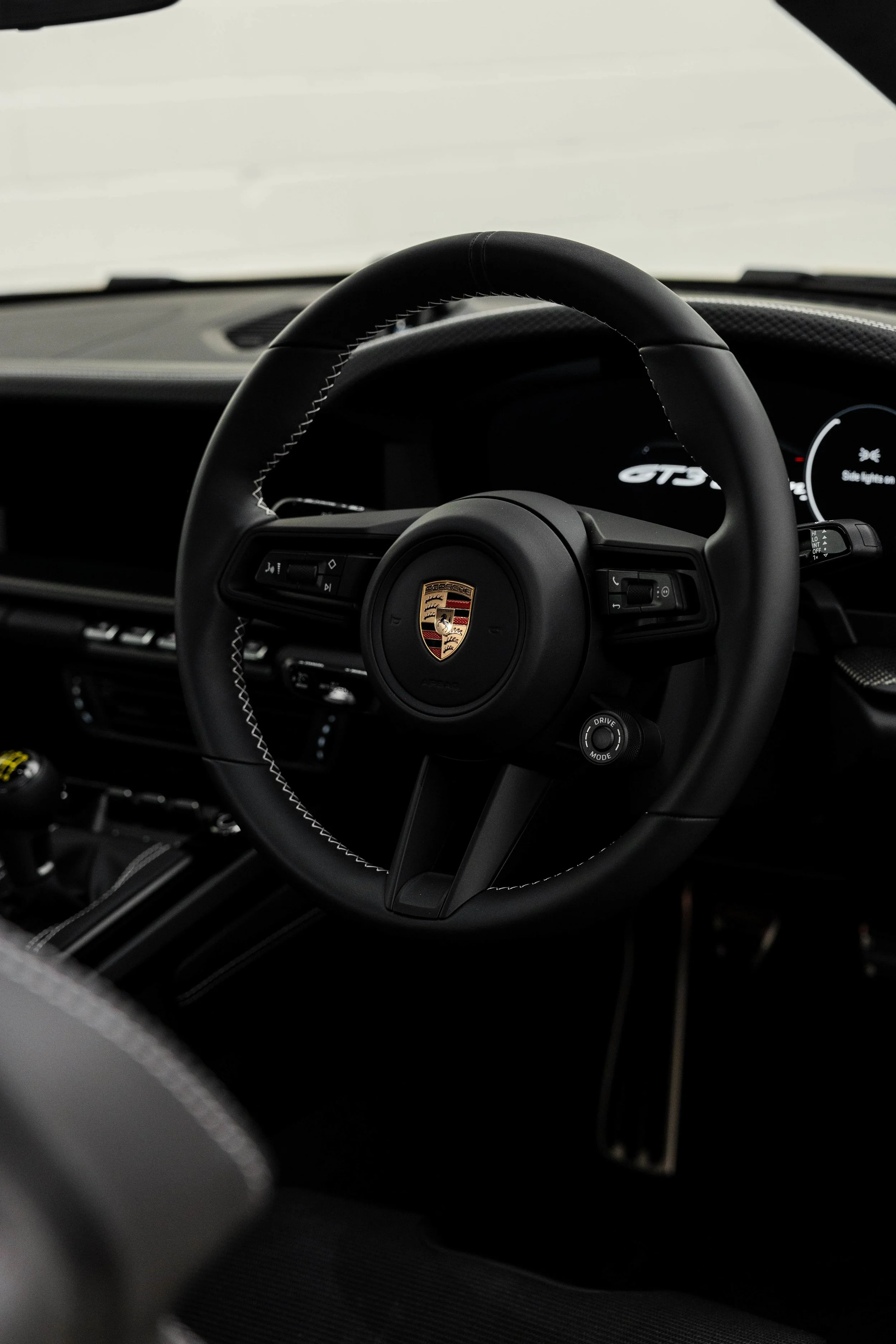 Cream Porsche 911 GT3 Touring interior detailing steering wheel and GT3 badge in Mona Vale