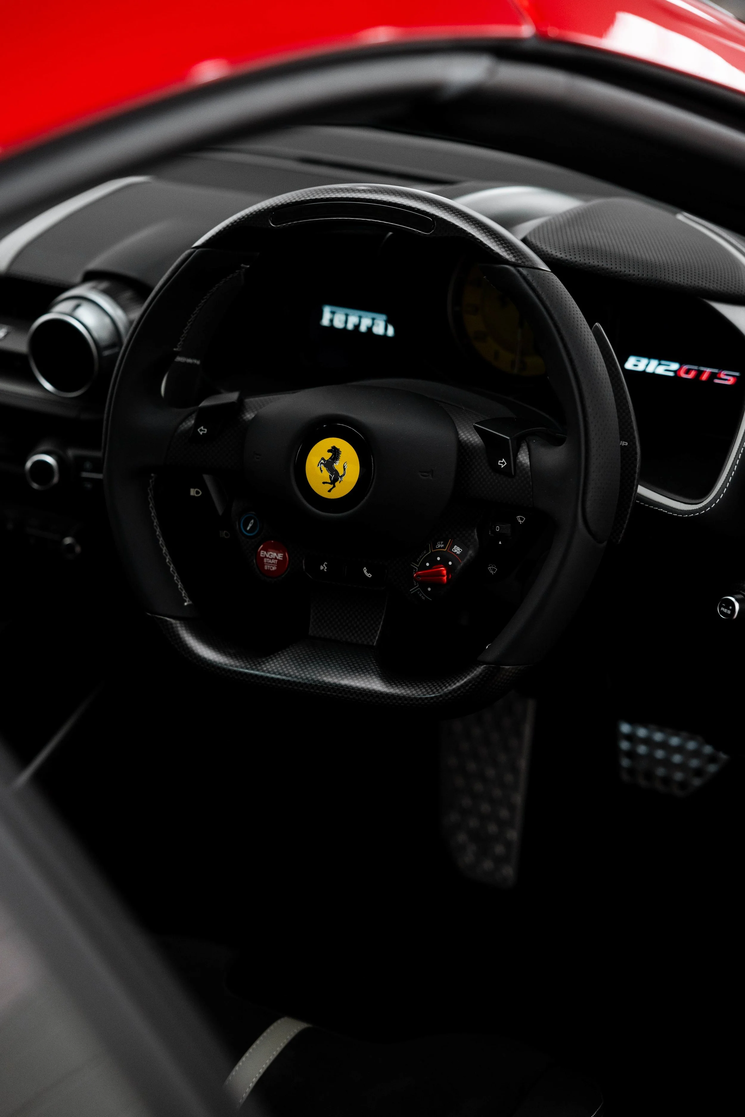 Red Ferrari 812 GTS interior detailing steering wheel with 812 GTS badge in Sydney