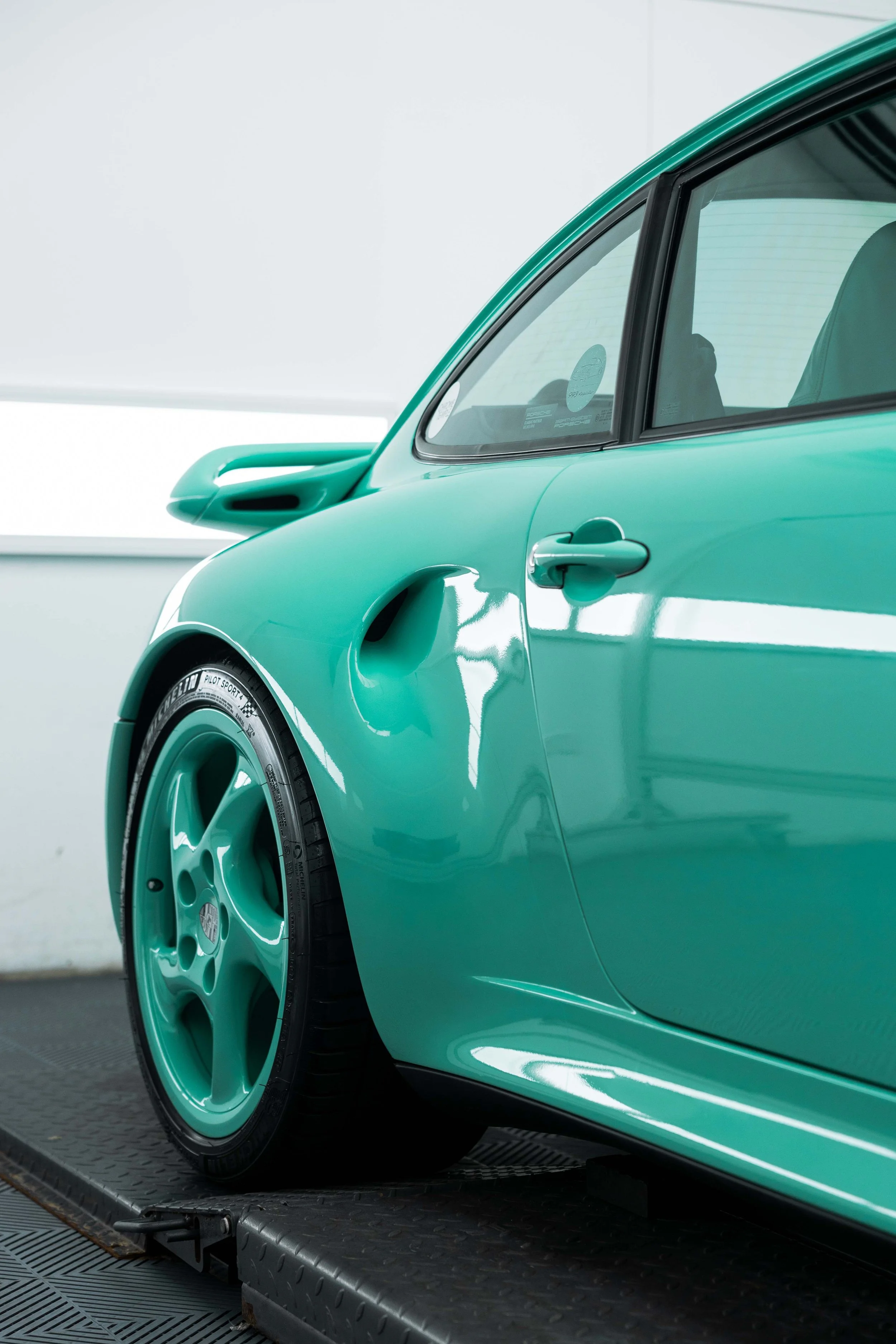 Mint green Porsche 993 door and wheel with XPEL Paint Protection Film in Mona Vale