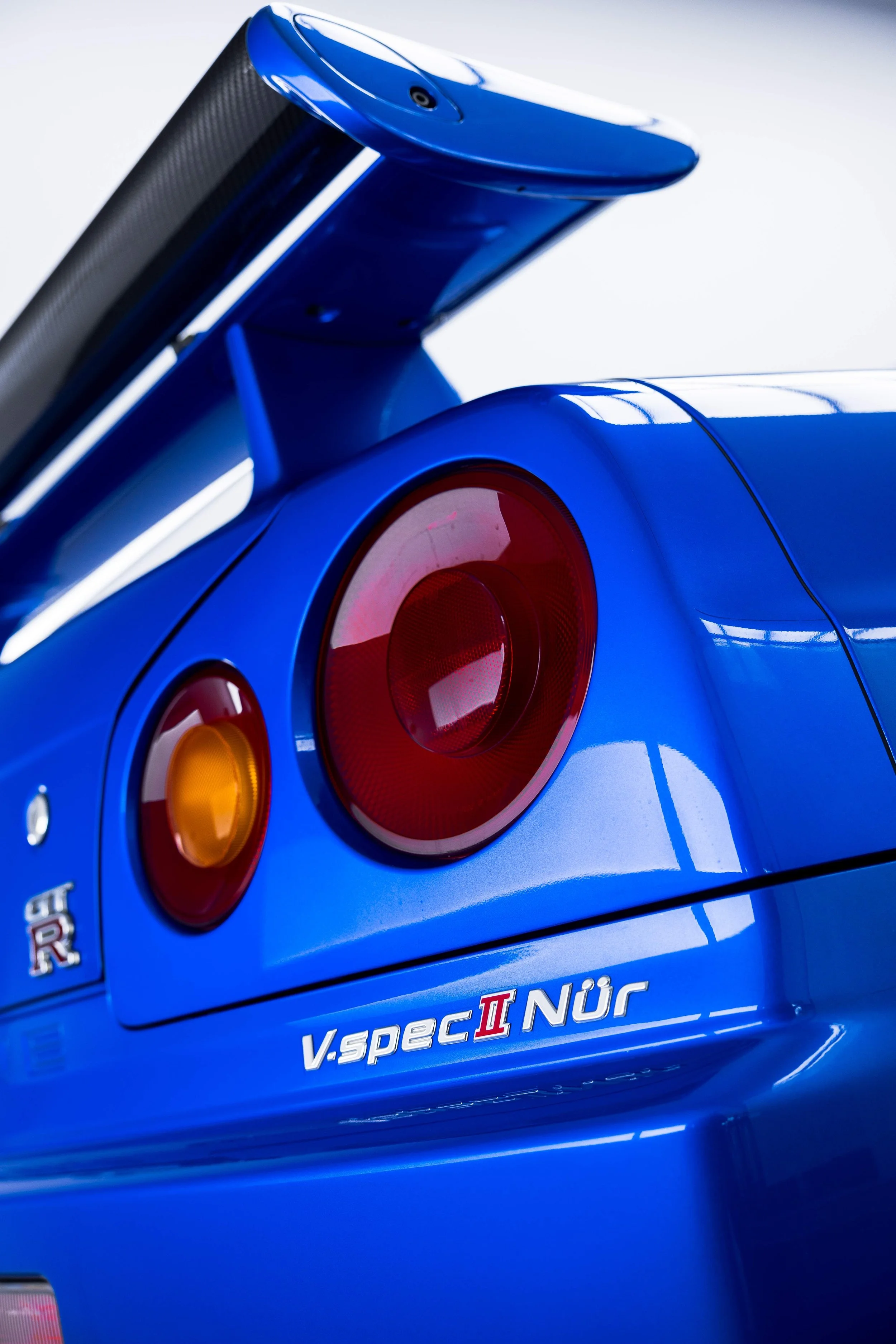 V-spec II Nur badge and tail light on Nissan R34 GT-R with XPEL Paint Protection Film in Mona Vale