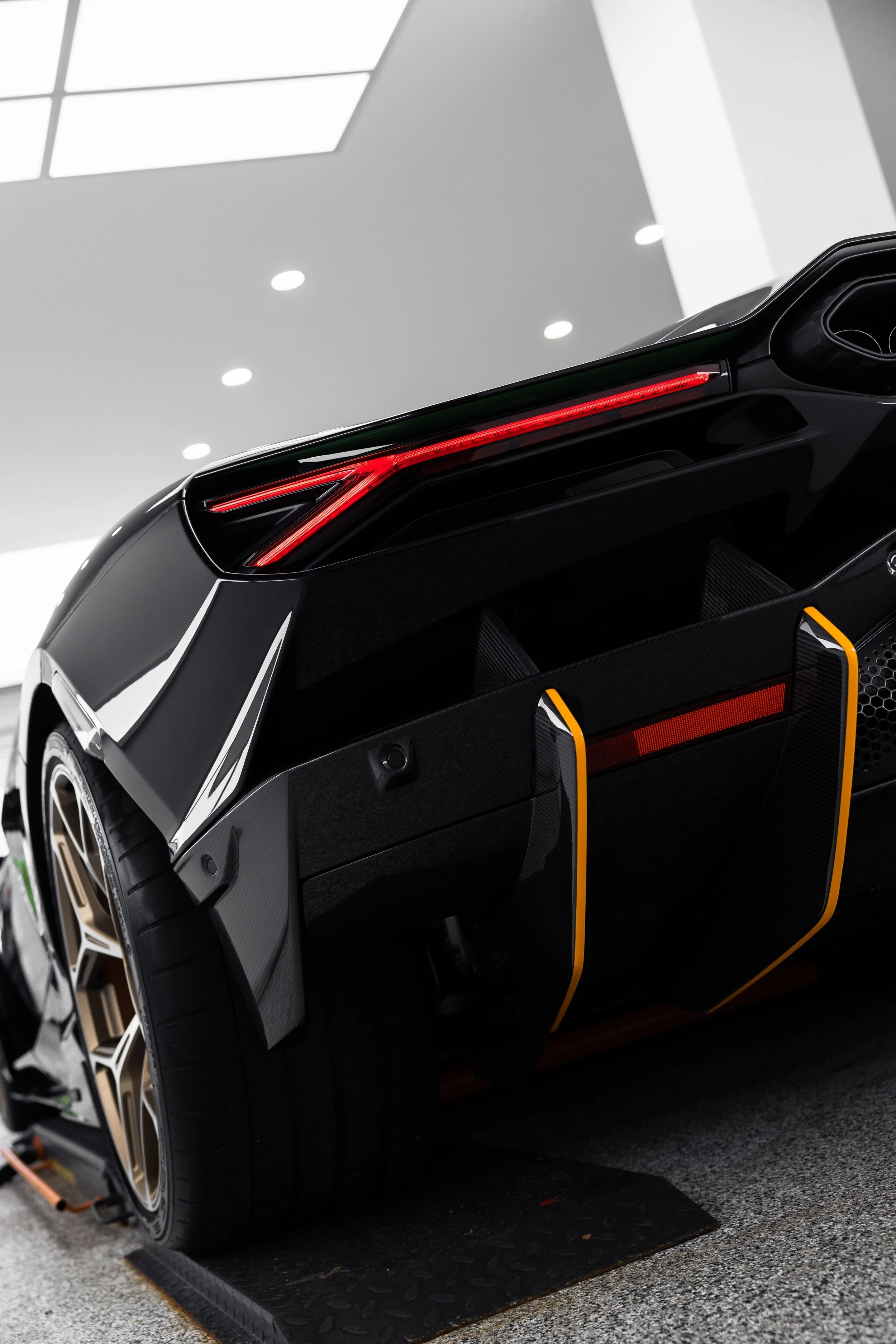 Rear view of black Lamborghini Revuelto with PPF protection by ADS in Sydney showroom