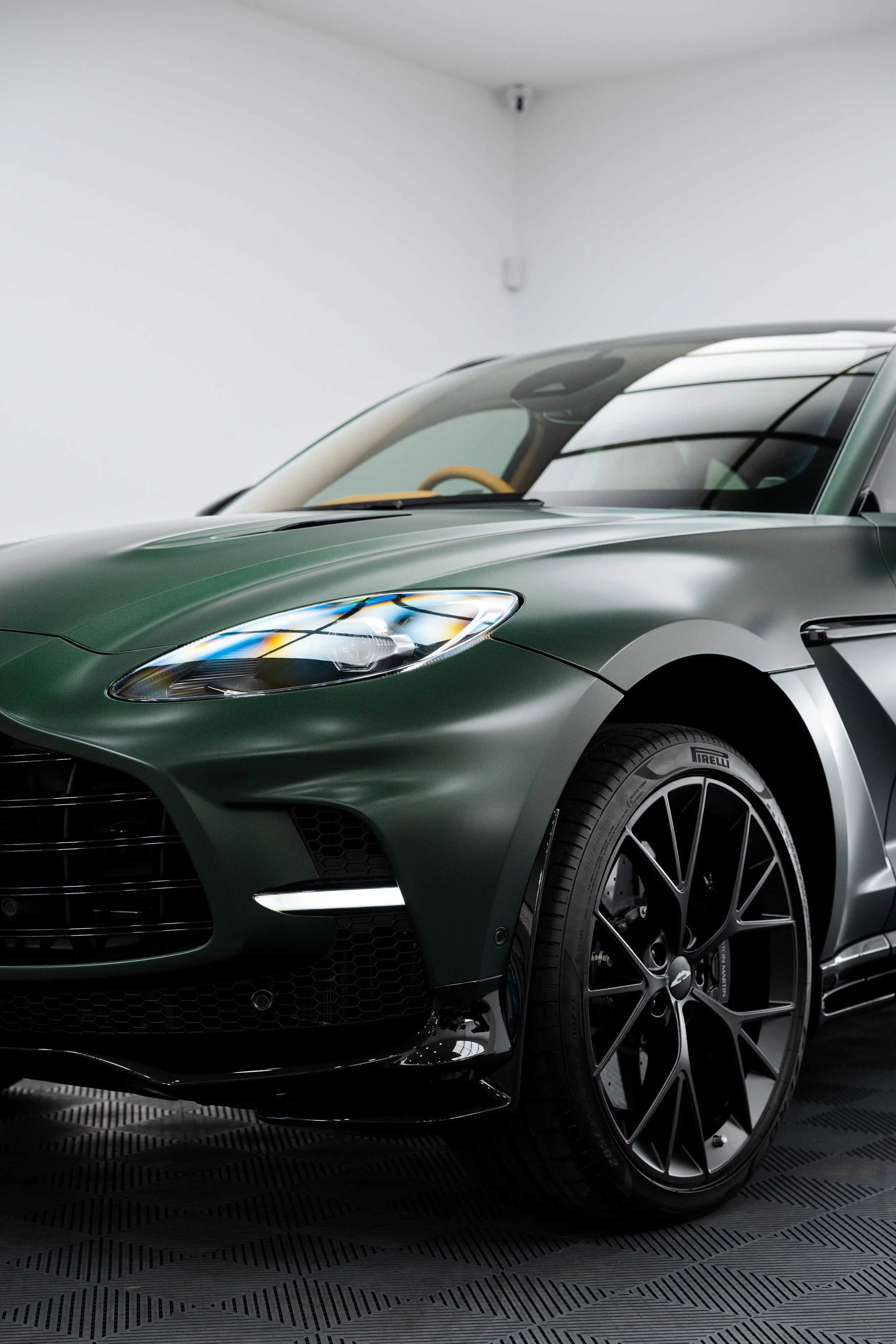 Matte green Aston Martin DBX front quarter and headlight with XPEL Stealth Paint Protection Film in Sydney