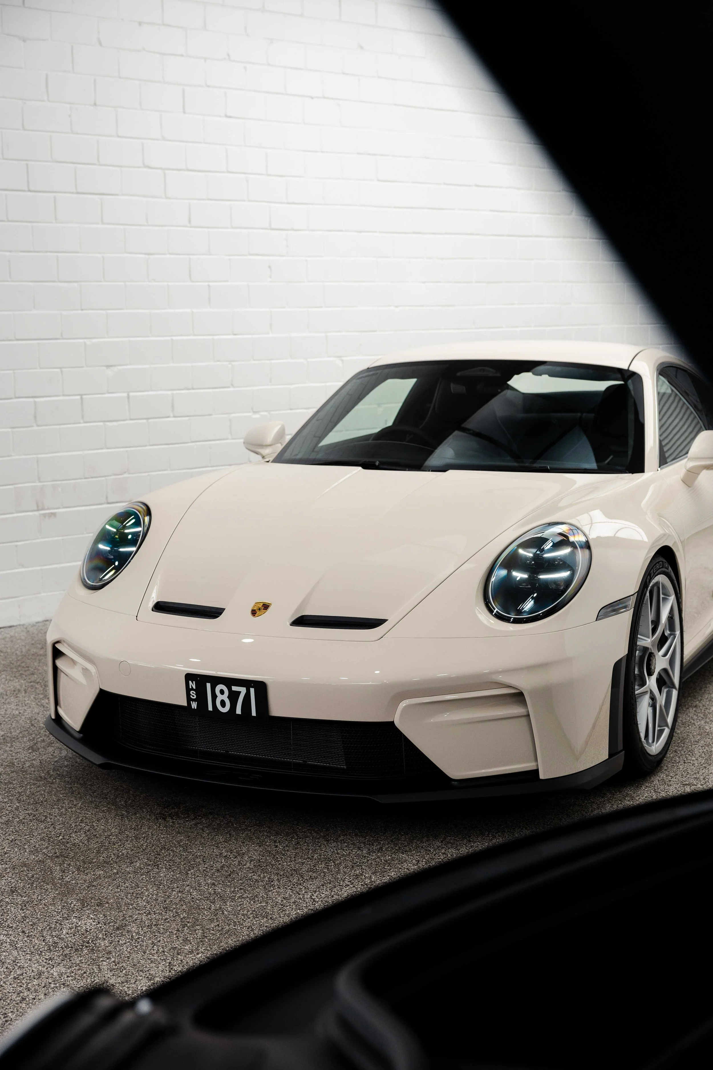 Cream Porsche 911 GT3 Touring front view outside studio with XPEL Paint Protection Film in Sydney
