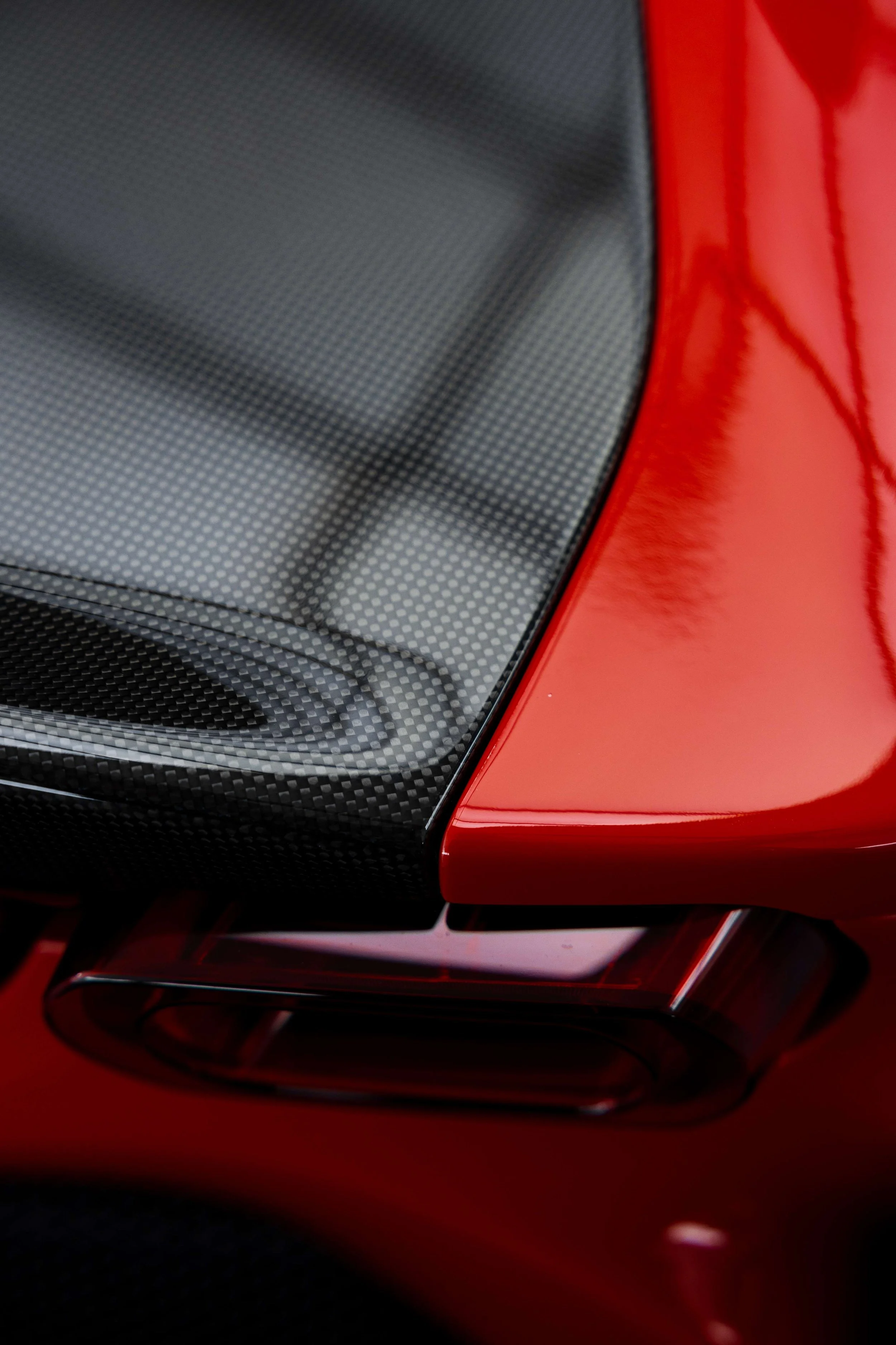 Red Ferrari SF90 Spyder carbon rear deck and rear guard with XPEL Paint Protection Film in Mona Vale