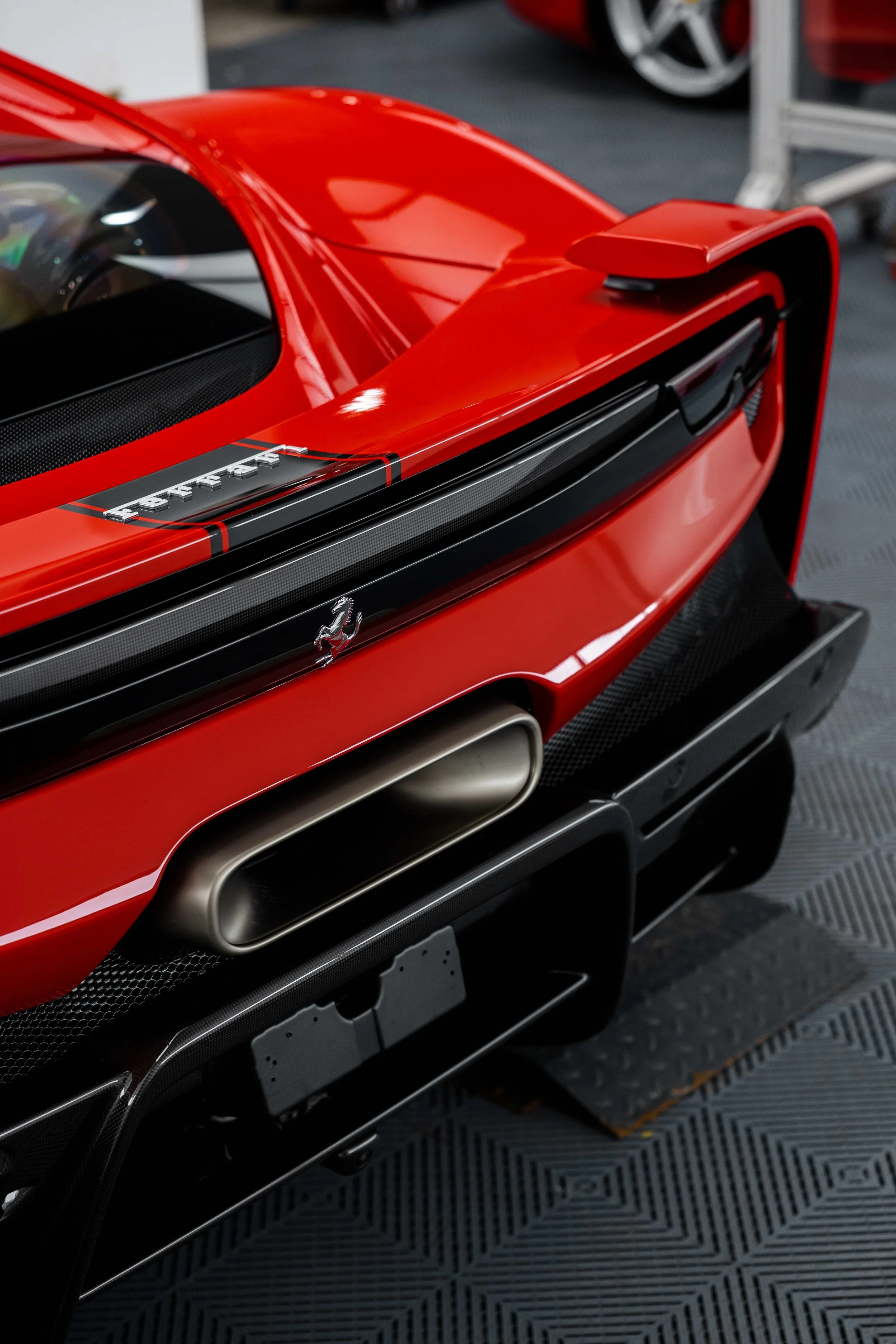Red Ferrari 296 Speciale rear deck, Ferrari script and exhaust outlet with XPEL Paint Protection Film in Mona Vale