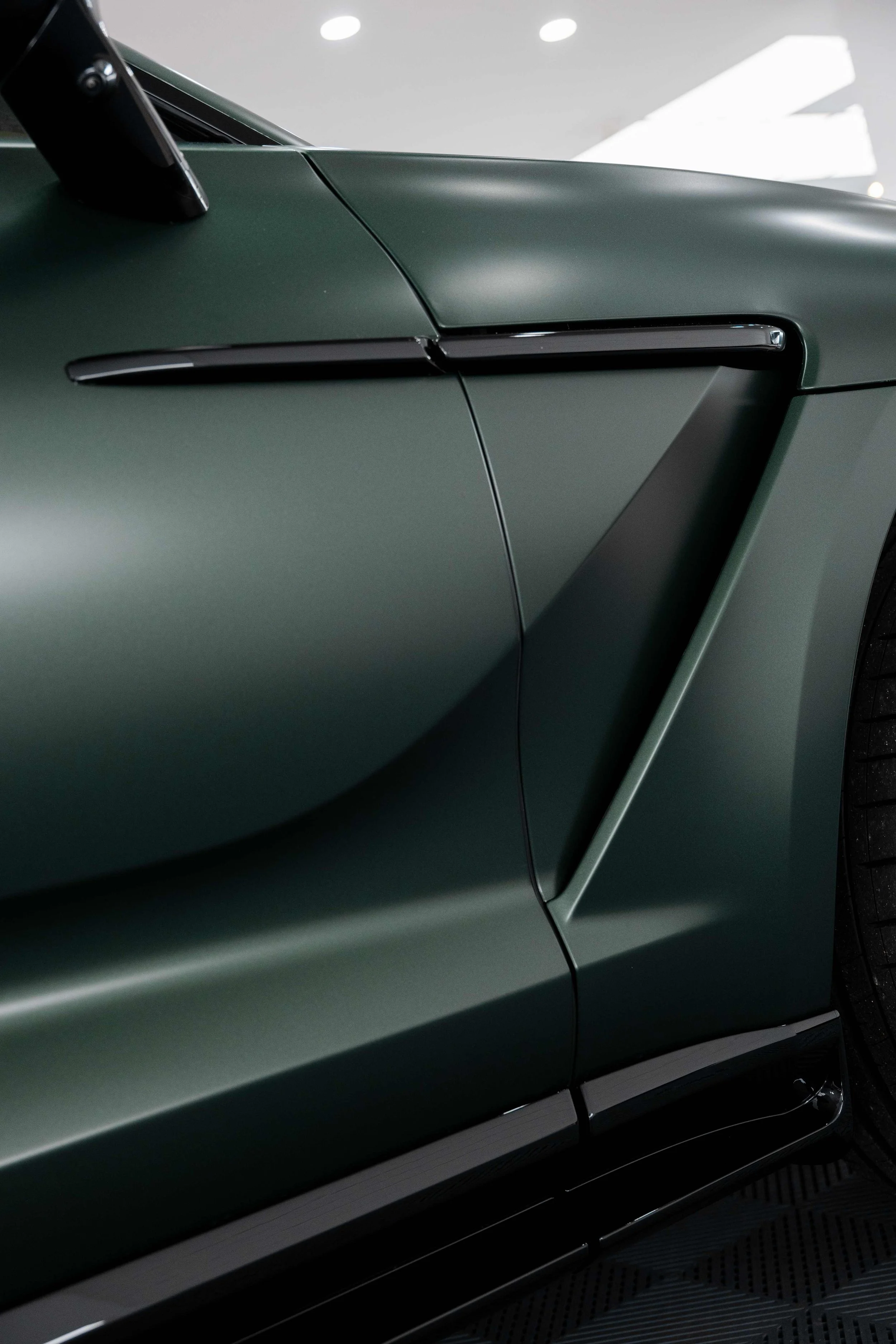 Matte green Aston Martin DBX bonnet vent and door detail with XPEL Stealth Paint Protection Film in Mona Vale