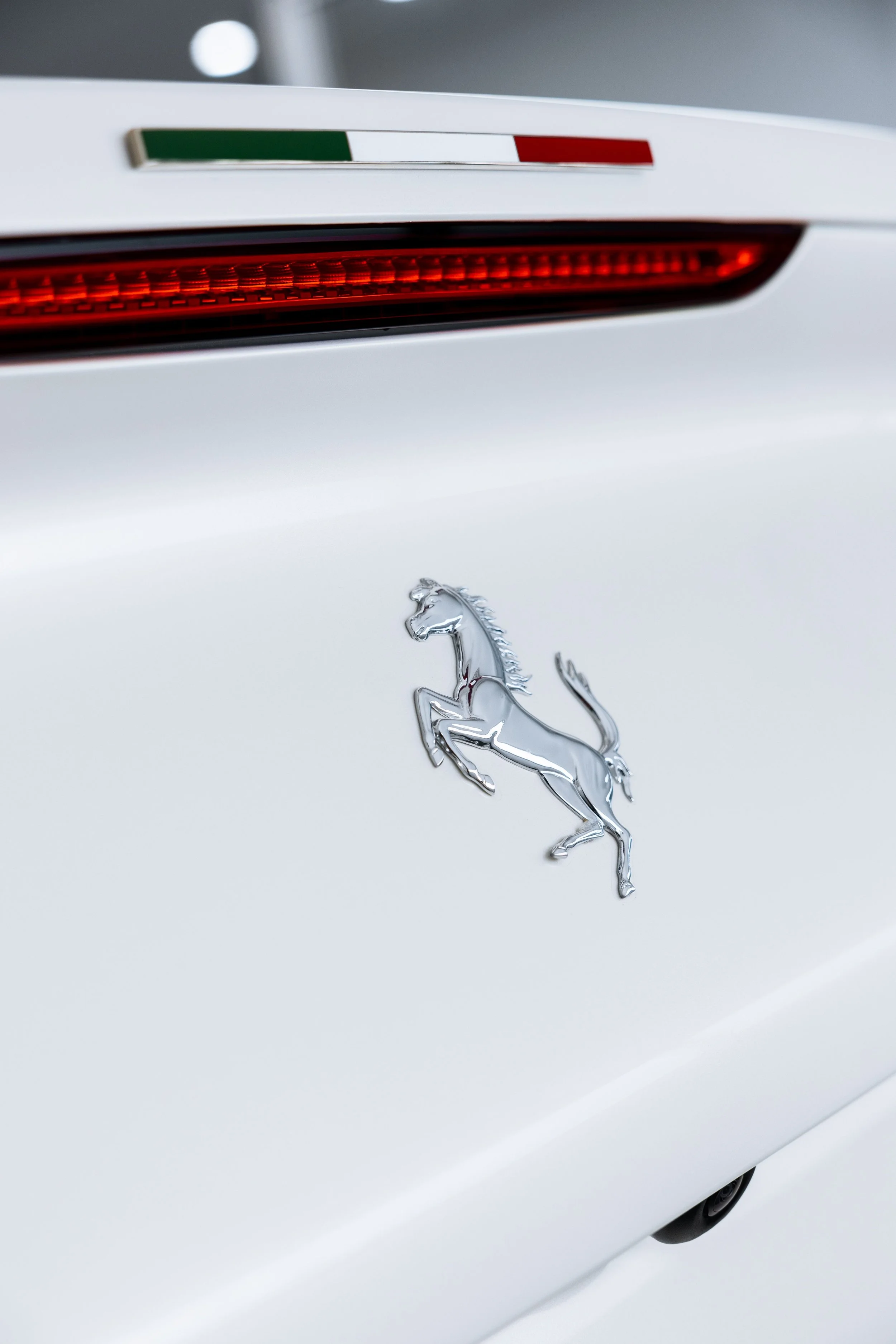 White Ferrari 812 GTS rear taillight and Italian flag badge with XPEL Paint Protection Film in Mona Vale