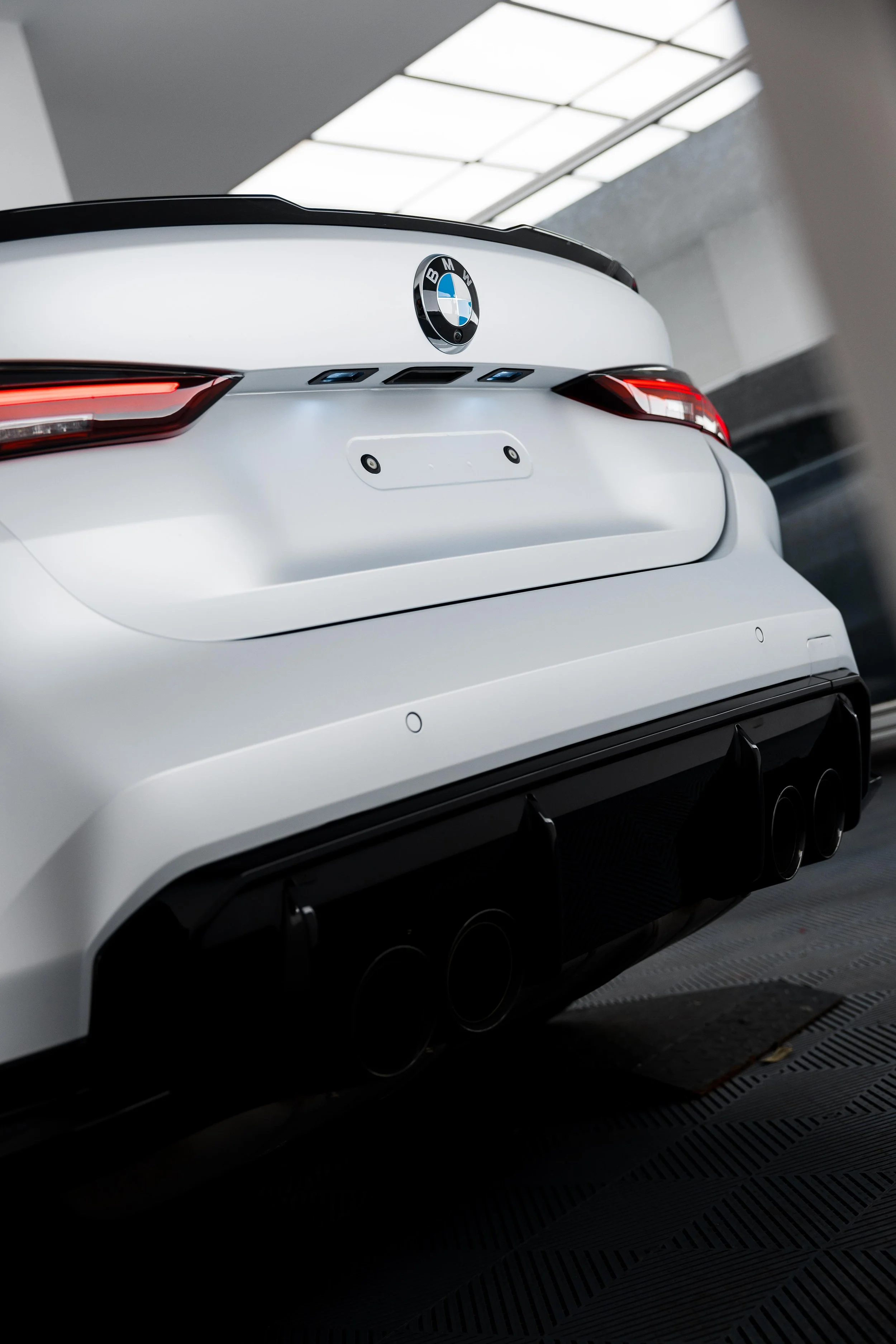 White BMW M4 Competition rear bumper with XPEL Paint Protection Film in Mona Vale
