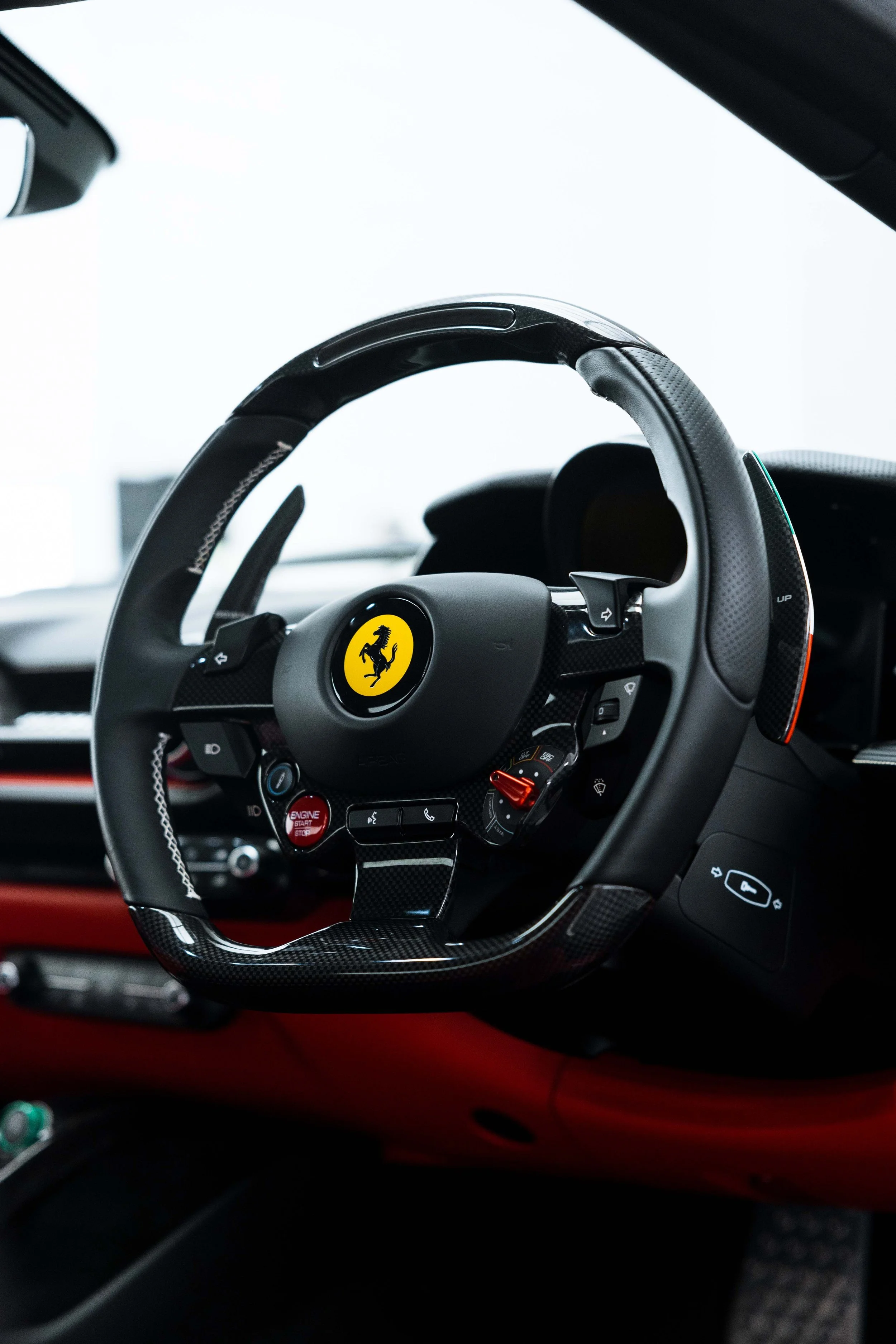 White Ferrari 812 GTS interior detailing steering wheel with Ferrari badge in Sydney