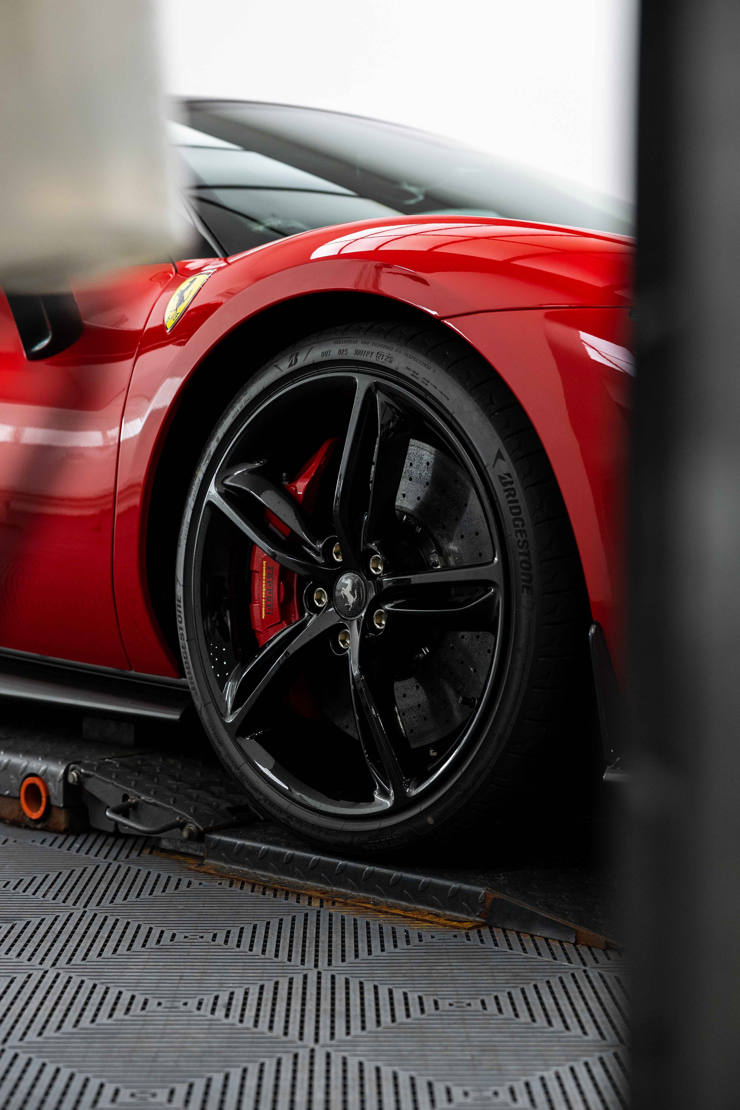 Red Ferrari 296 GTS wheel and red brake caliper with XPEL Paint Protection Film in Mona Vale