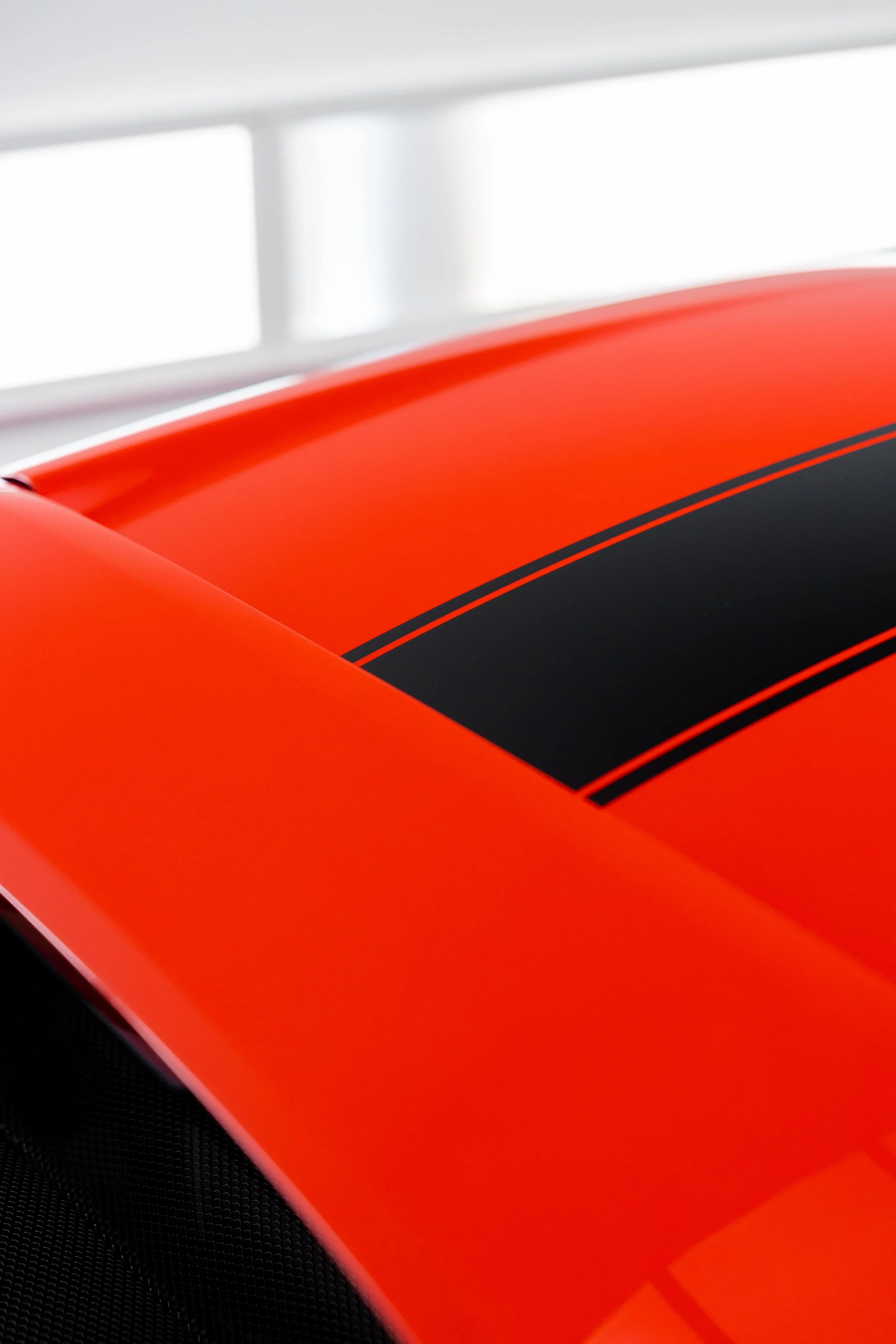 Red Ferrari 296 Speciale front guard and black racing stripe with XPEL Paint Protection Film in Mona Vale
