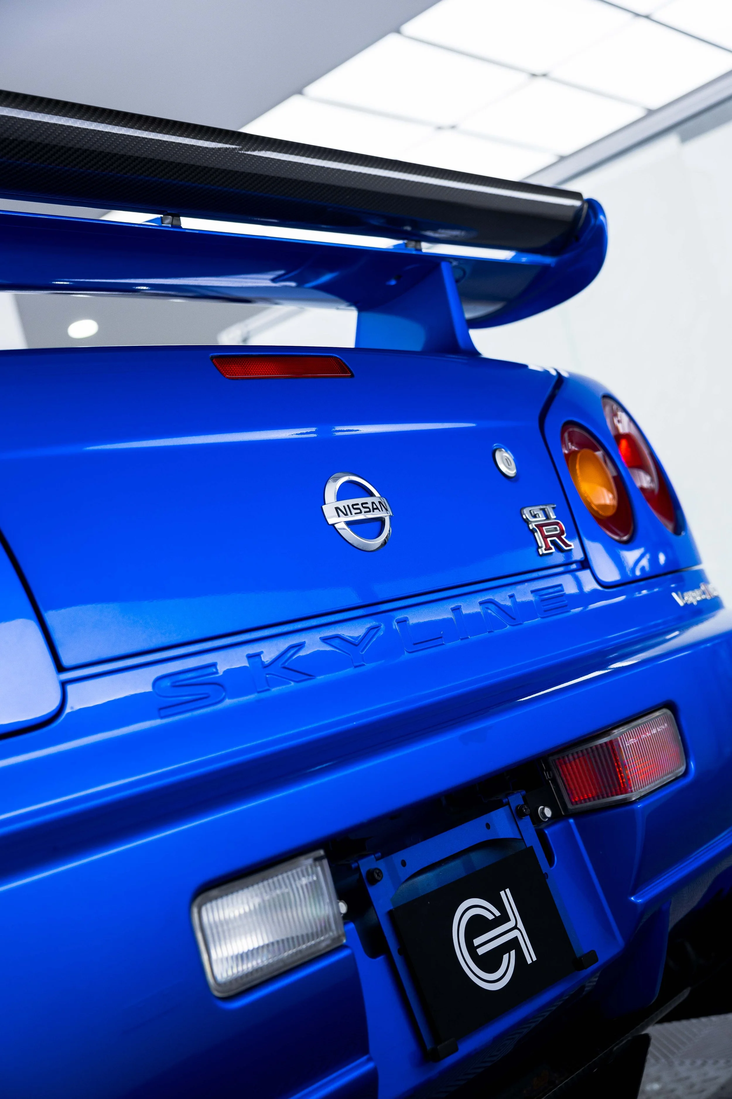 Nissan Skyline GT-R badge on R34 Nur with XPEL Paint Protection Film in Sydney