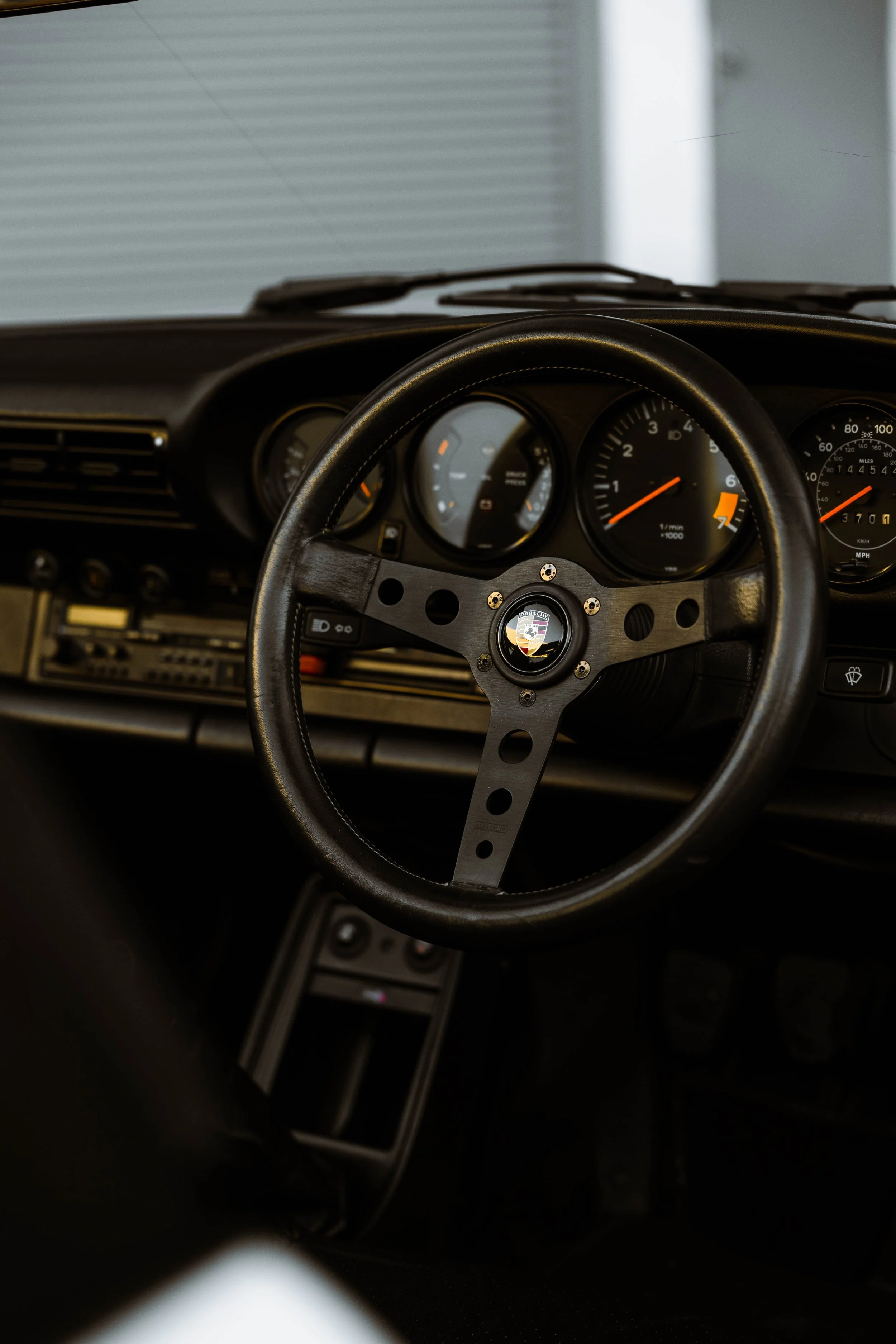 Silver 1989 Porsche 911 Carrera Targa interior detailing steering wheel and dashboard in Sydney