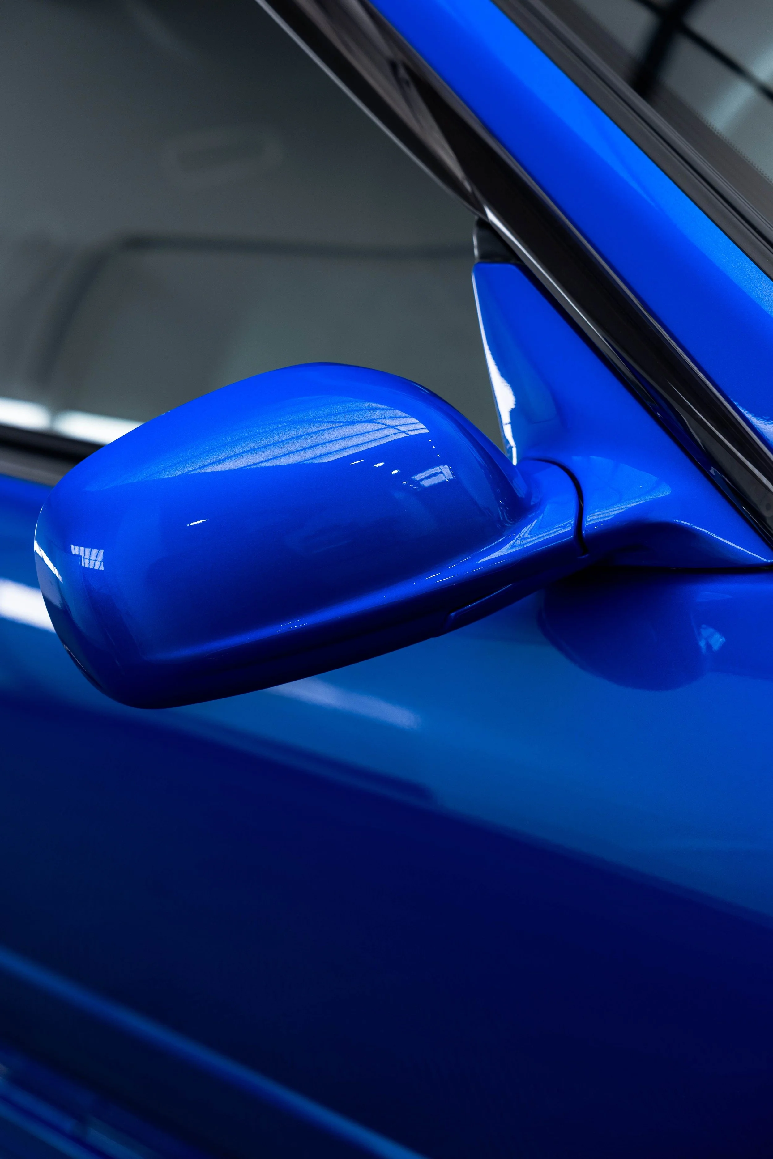 Bayside blue Nissan R34 GT-R Nur wing mirror with XPEL Paint Protection Film in Mona Vale