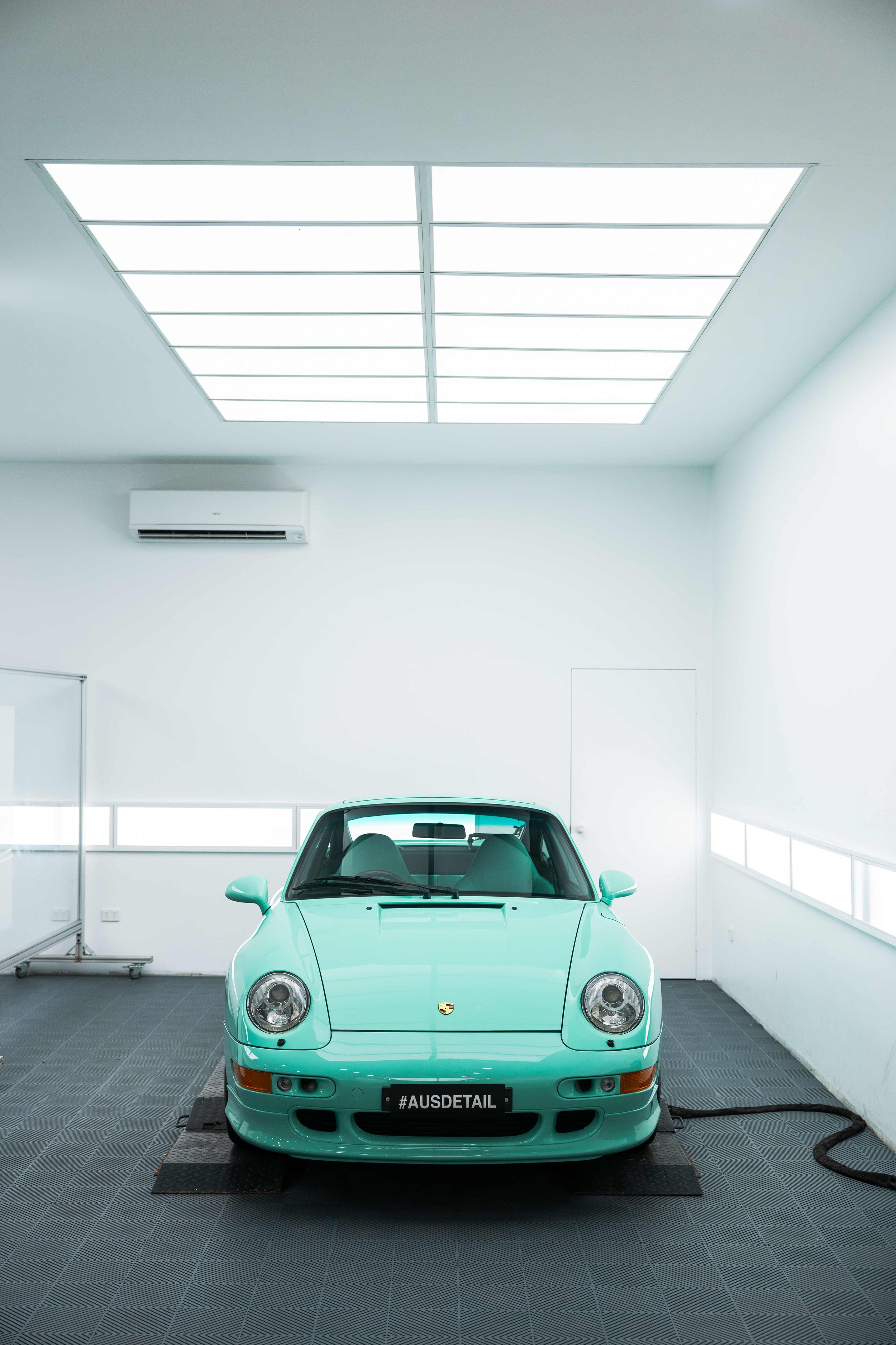 Mint green Porsche 993 front end in ADS detailing studio in Mona Vale