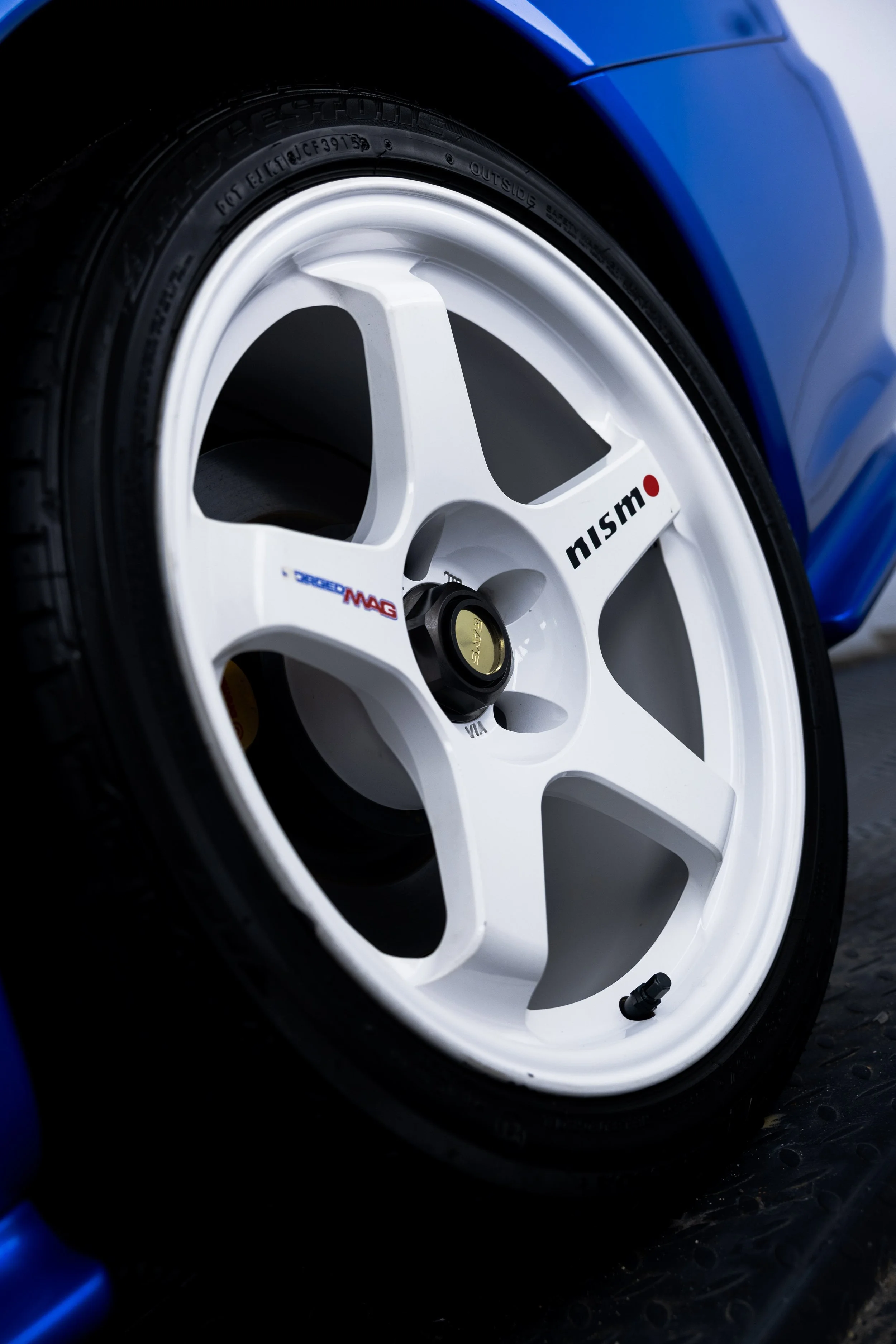 Nismo alloy wheel on bayside blue Nissan R34 GT-R Nur after detailing in Mona Vale