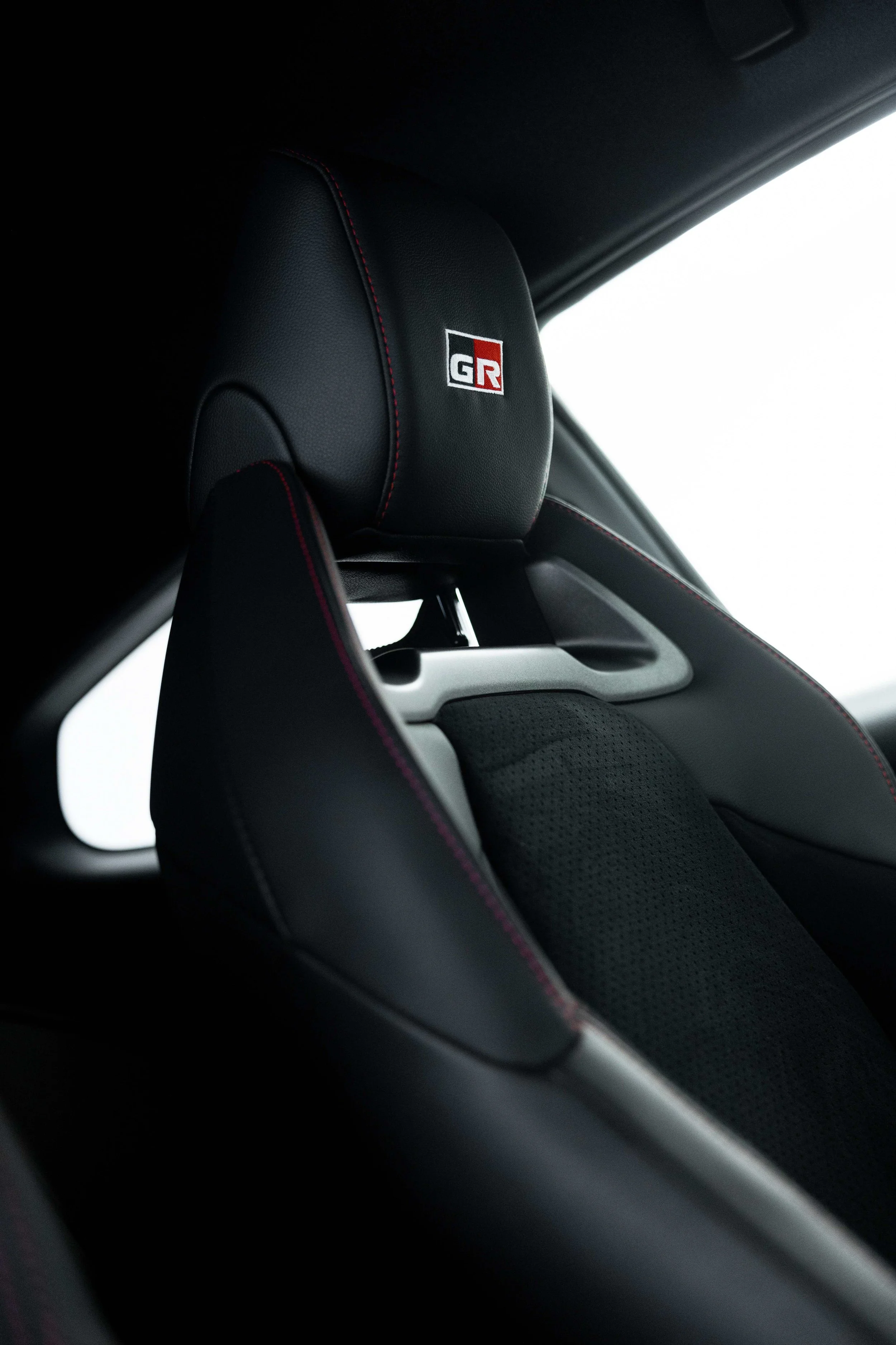 Matte grey Toyota GR Yaris interior detailing seat headrest with GR badge in Sydney