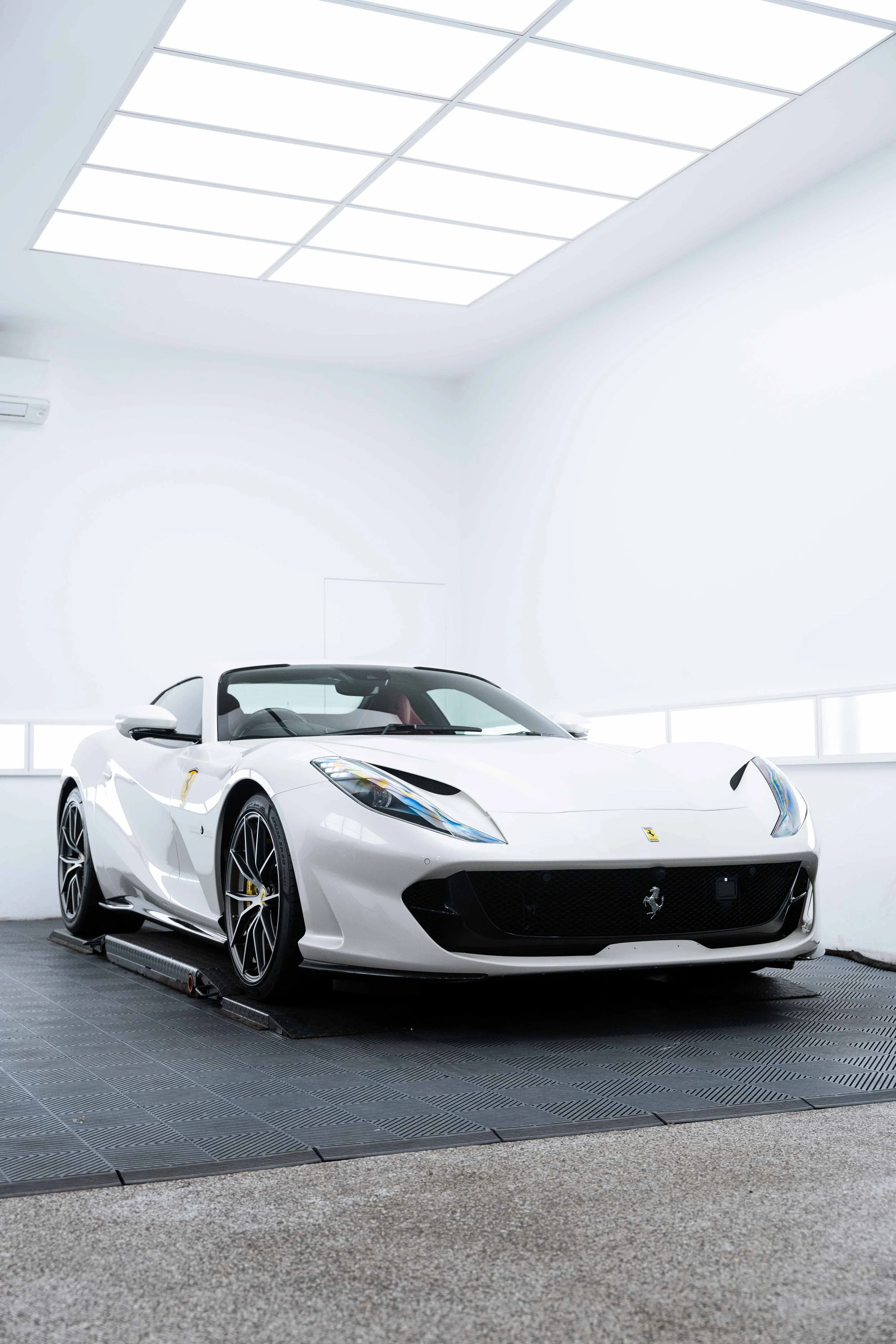 White Ferrari 812 GTS front three quarter roof down with XPEL Paint Protection Film in Sydney