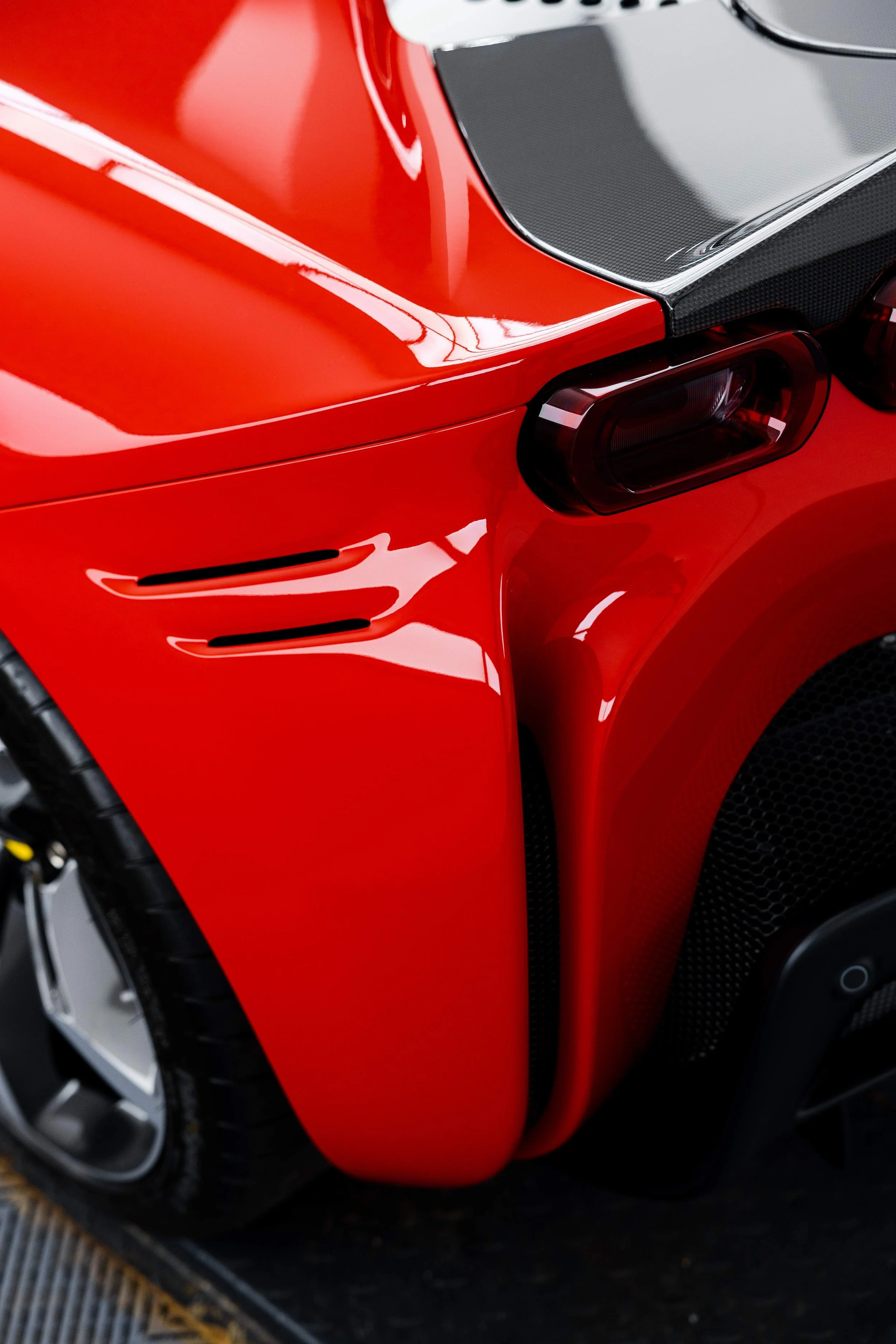 Red Ferrari SF90 Spyder rear guard vents and taillight with XPEL Paint Protection Film in Sydney