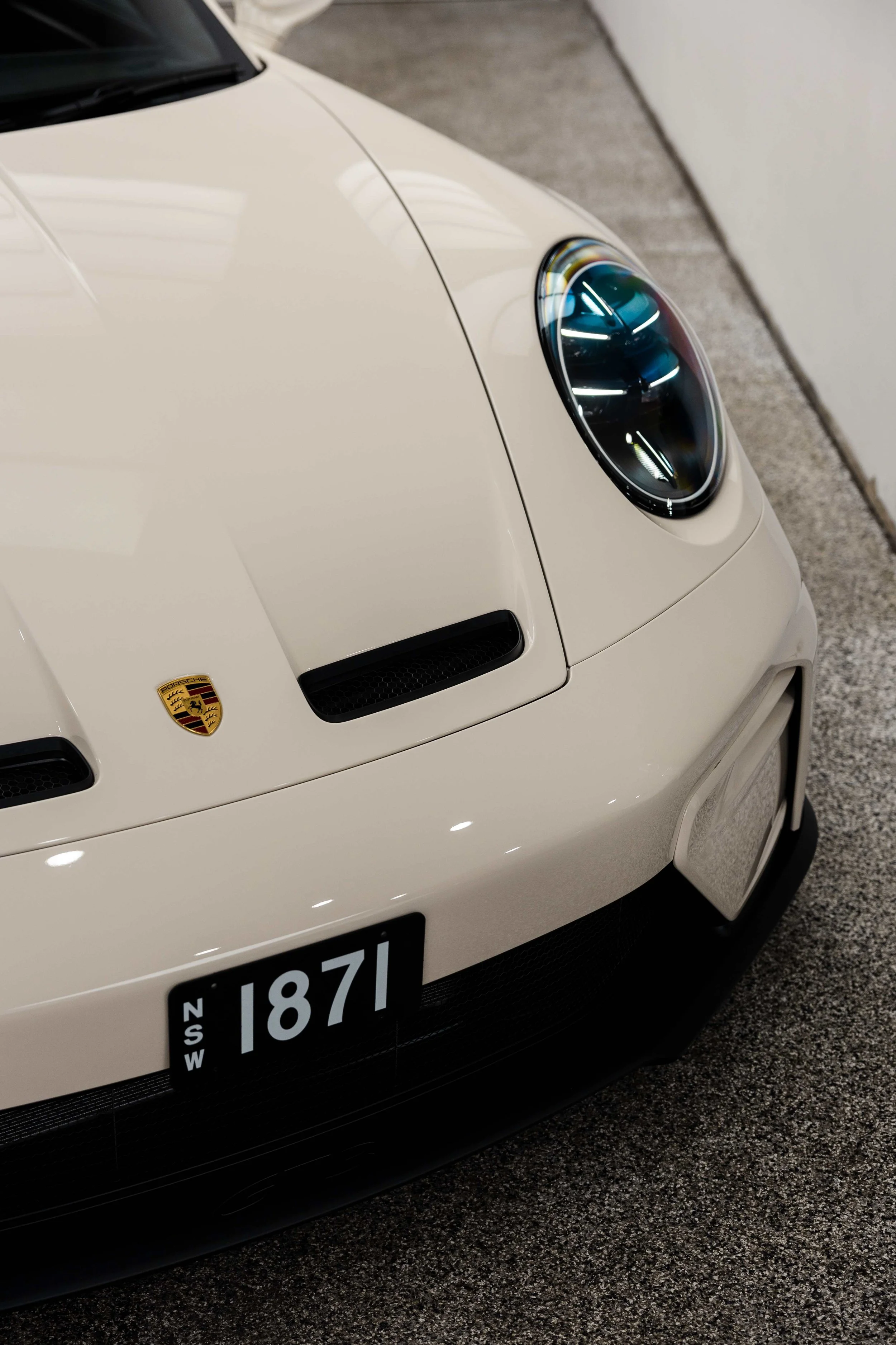 Cream Porsche 911 GT3 Touring front bonnet and Porsche badge with XPEL Paint Protection Film in Mona Vale
