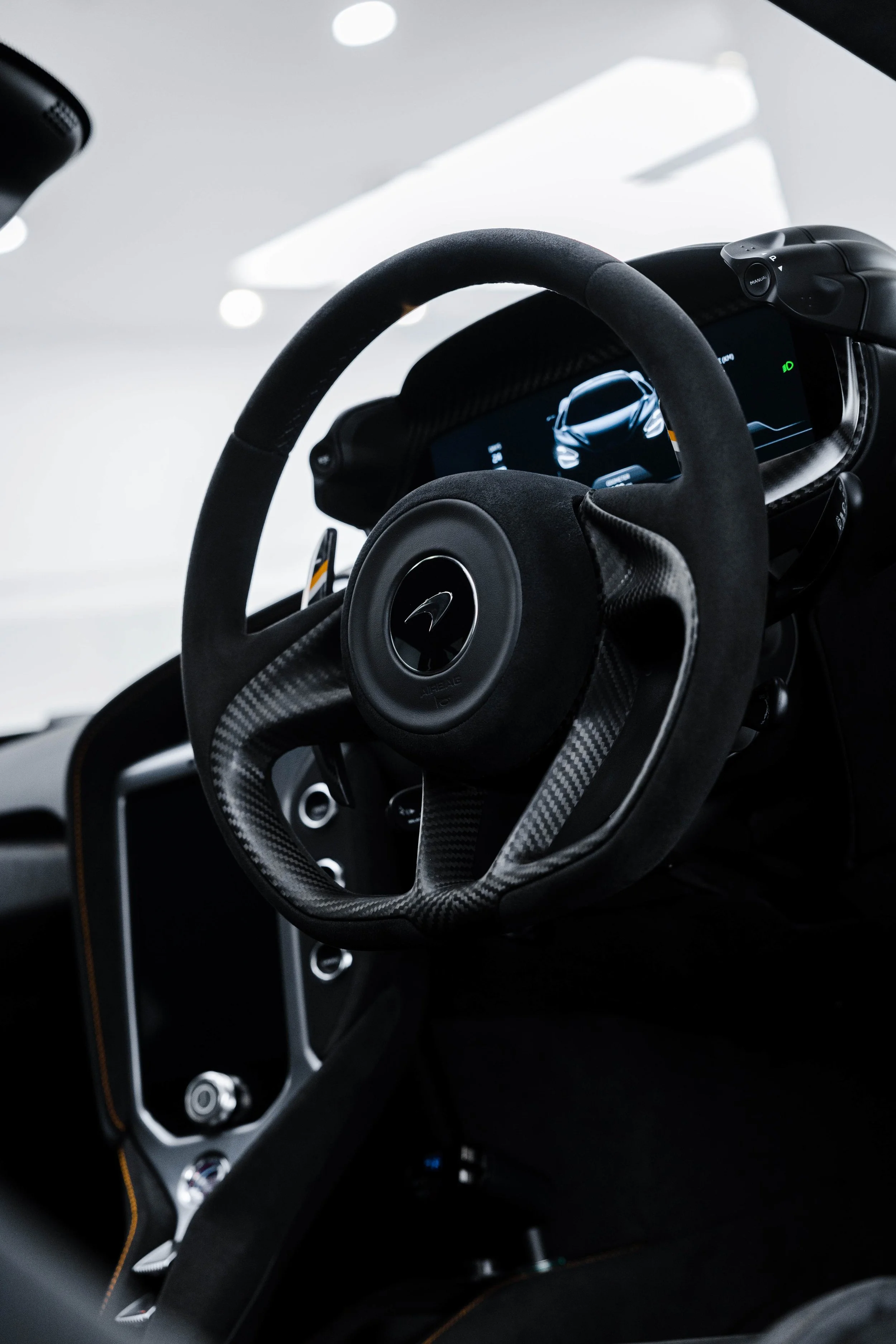 Black McLaren 750S interior detailing steering wheel and digital dash in Sydney