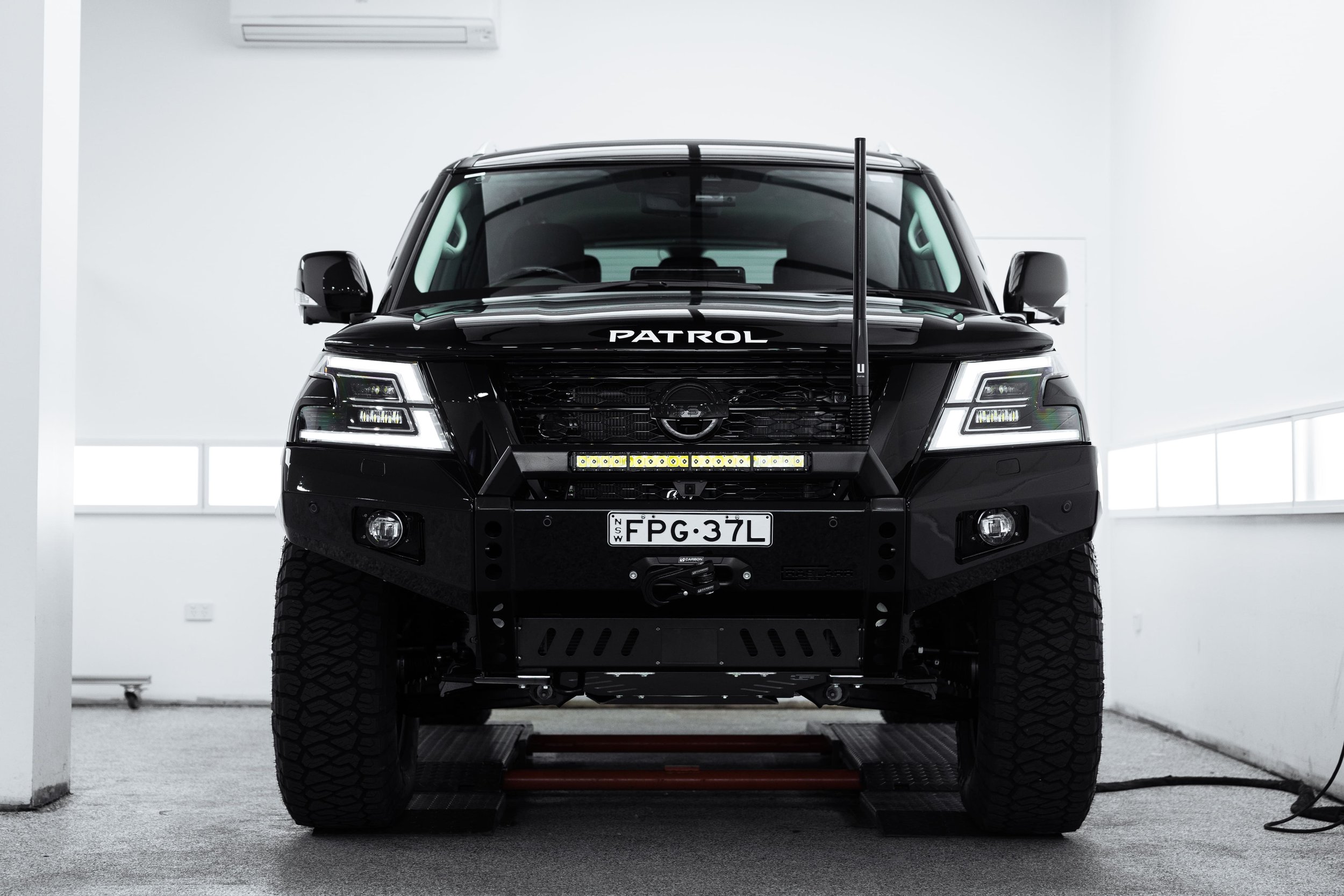 Front view of Y62 Nissan Patrol with bull bar and off-road setup after detailing by ADS in Sydney