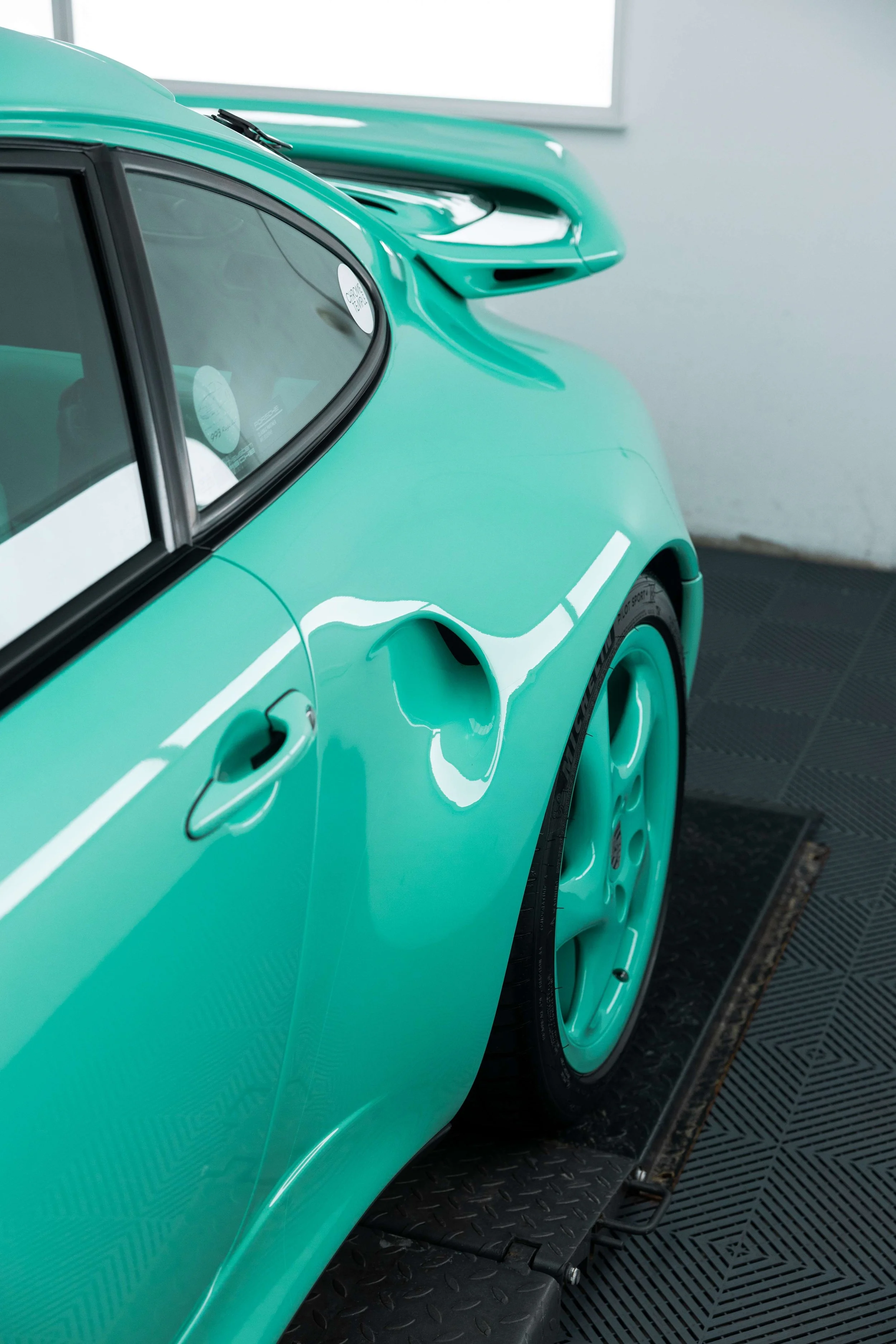 Mint green Porsche 993 door and rear wheel with XPEL Paint Protection Film in Sydney