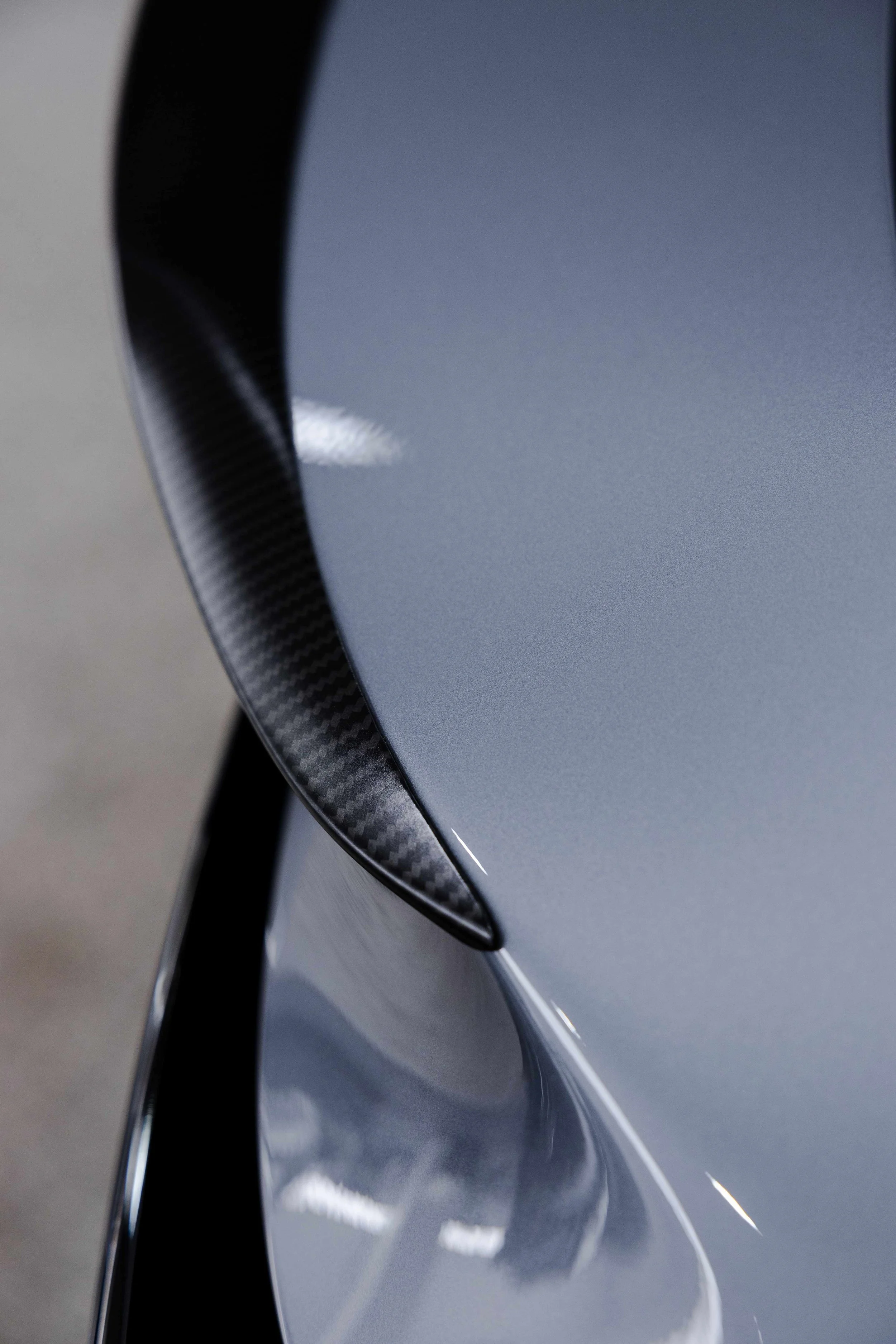Silver Tesla Model Y rear spoiler carbon detail with XPEL Paint Protection Film in Sydney