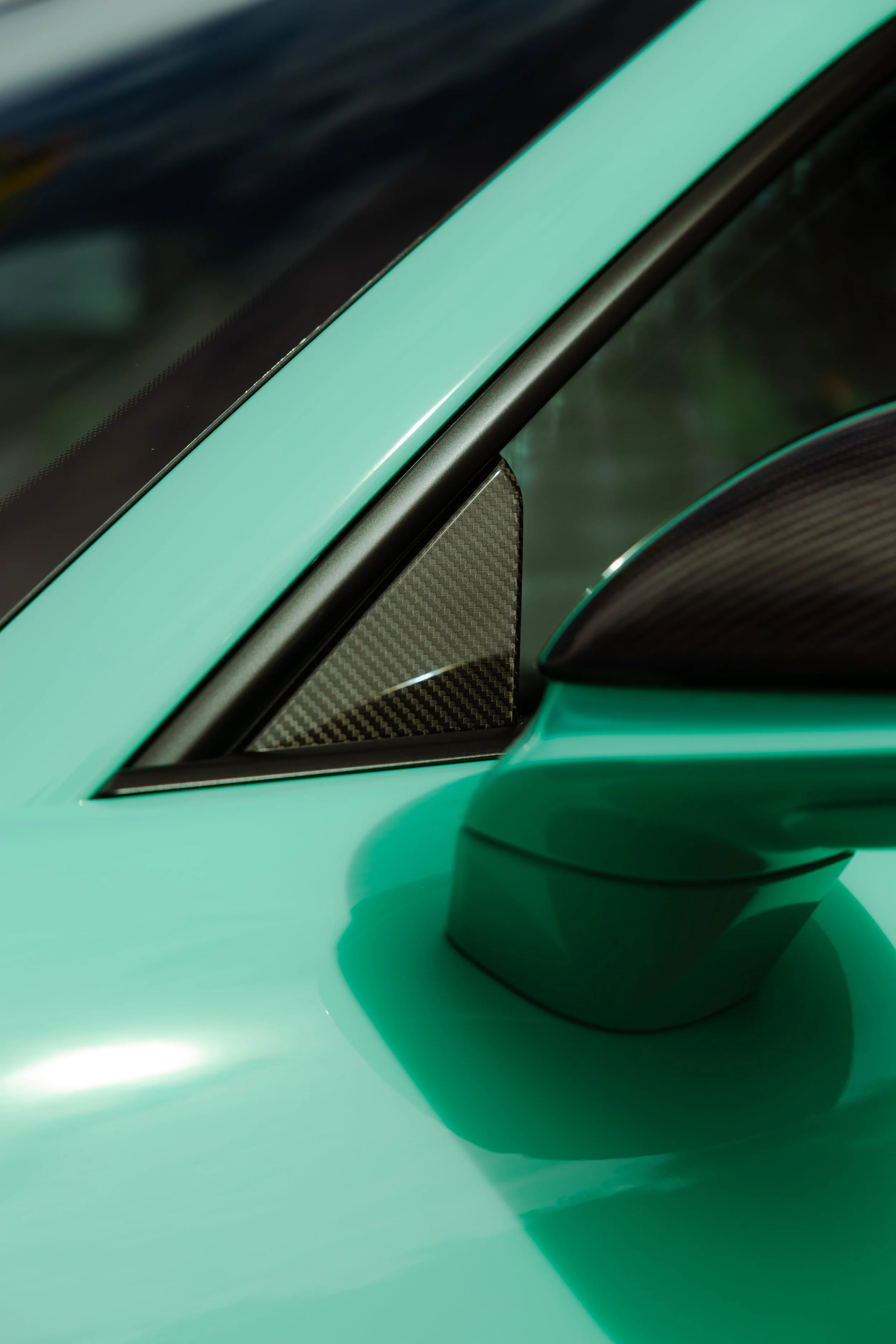 Mint green Porsche 911 GT3 door mirror and quarter window detail with XPEL Paint Protection Film in Sydney