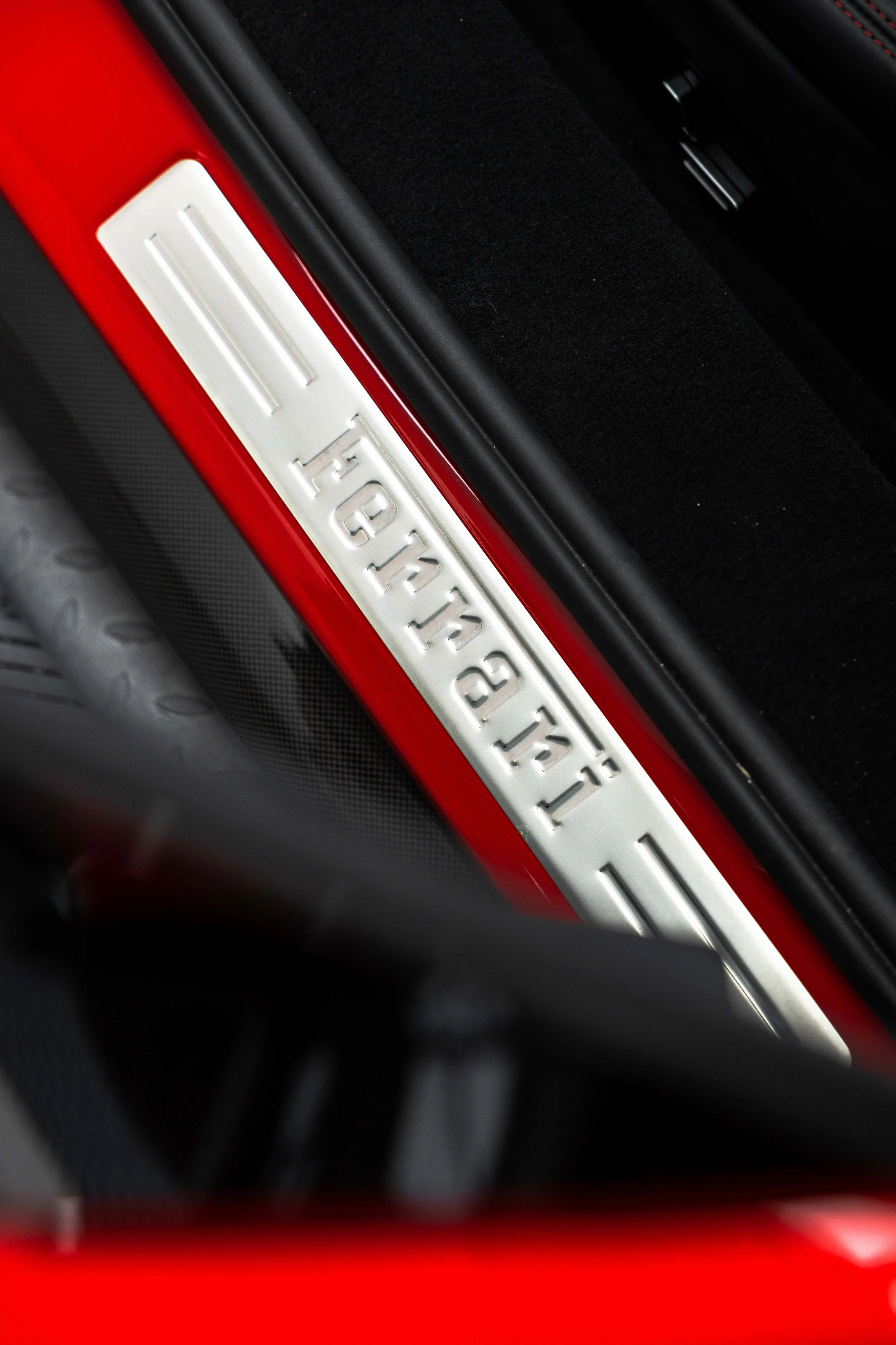 Red Ferrari 296 GTS interior detailing door sill Ferrari script in Mona Vale