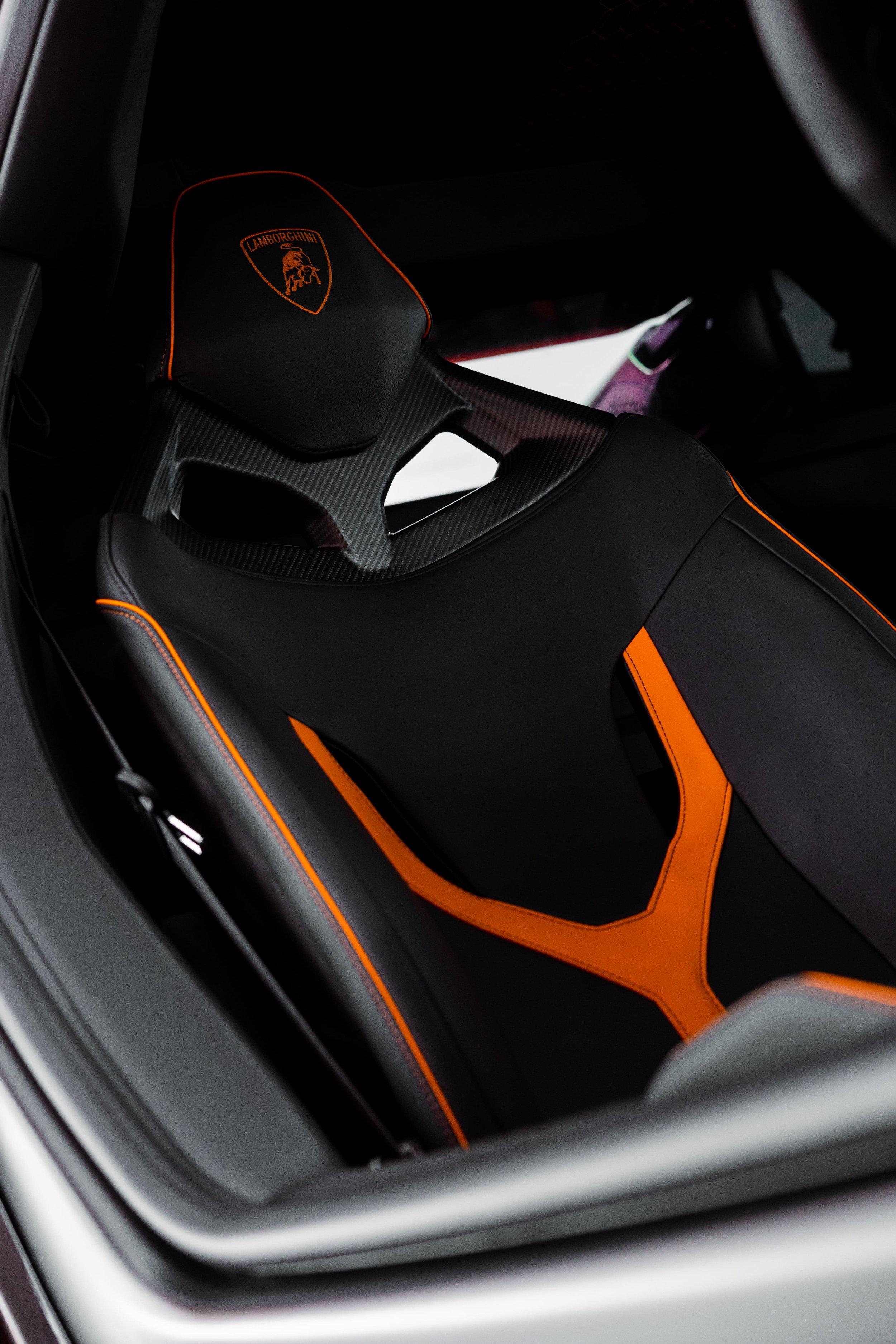 Lamborghini Revuelto interior sport seat with orange accents and carbon fibre detail, protected by ADS in Mona Vale