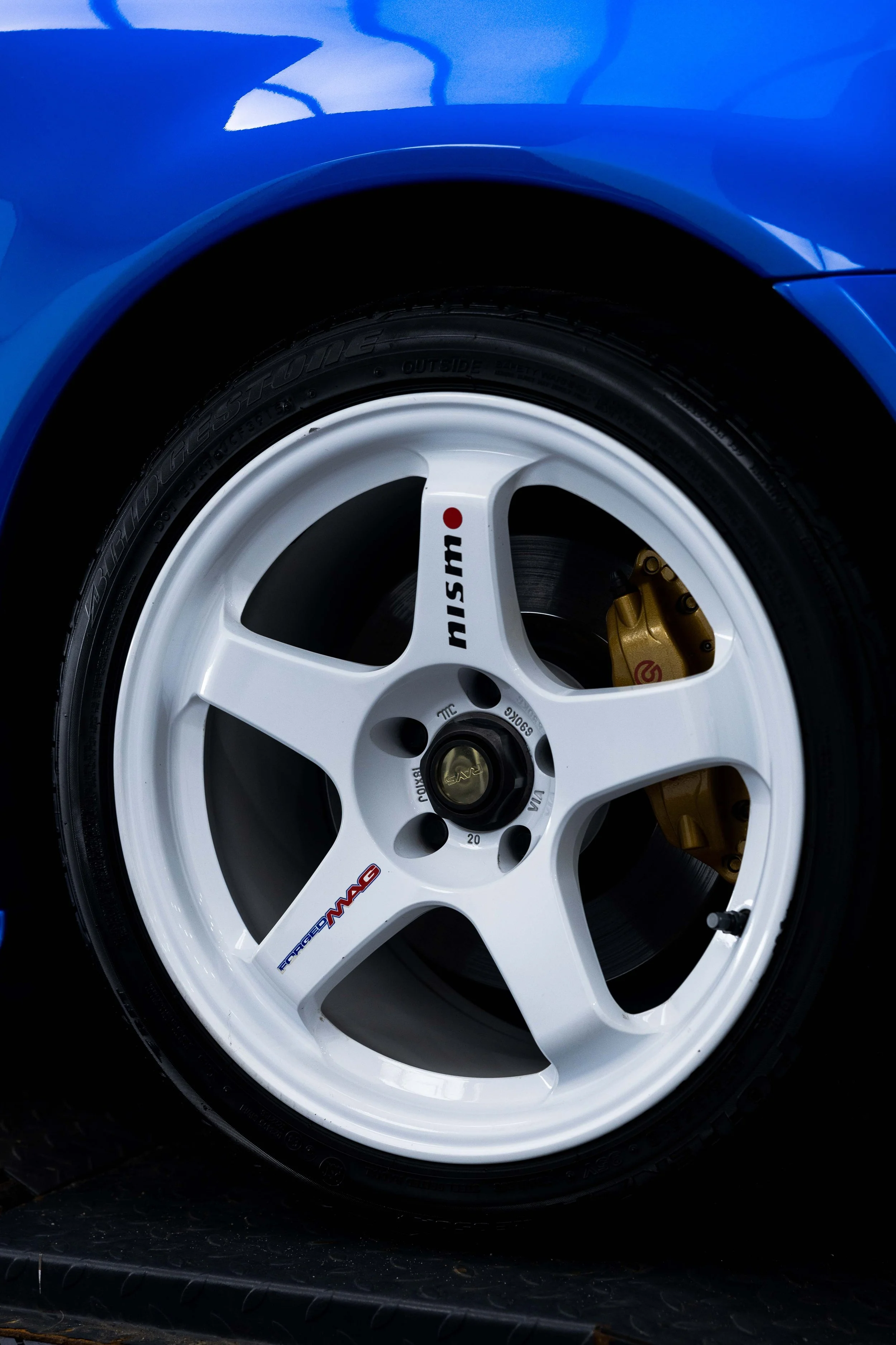 Nissan R34 GT-R Nur alloy wheel and brake caliper after detailing in Mona Vale